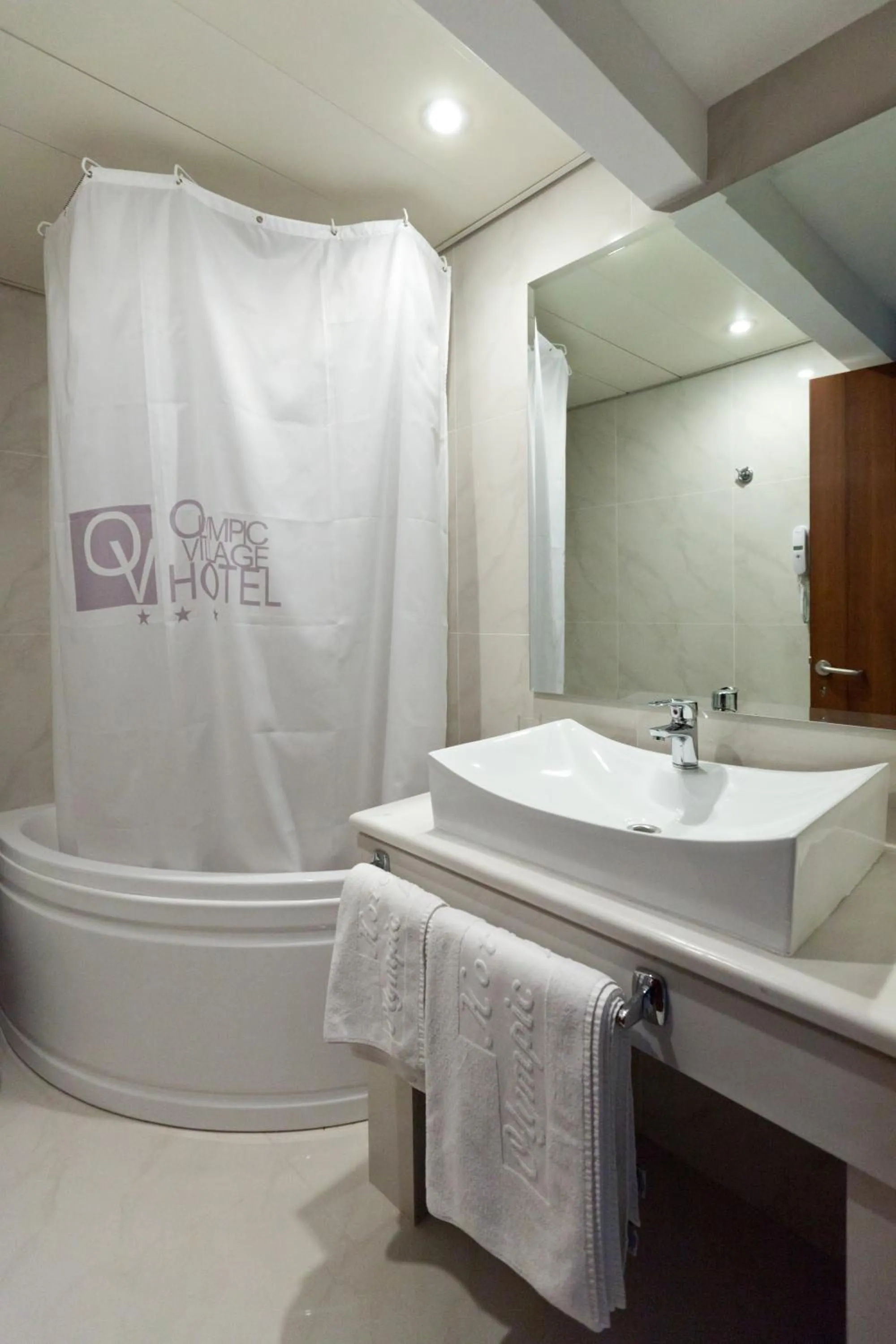 Bathroom in Olympic Village Hotel & SPA