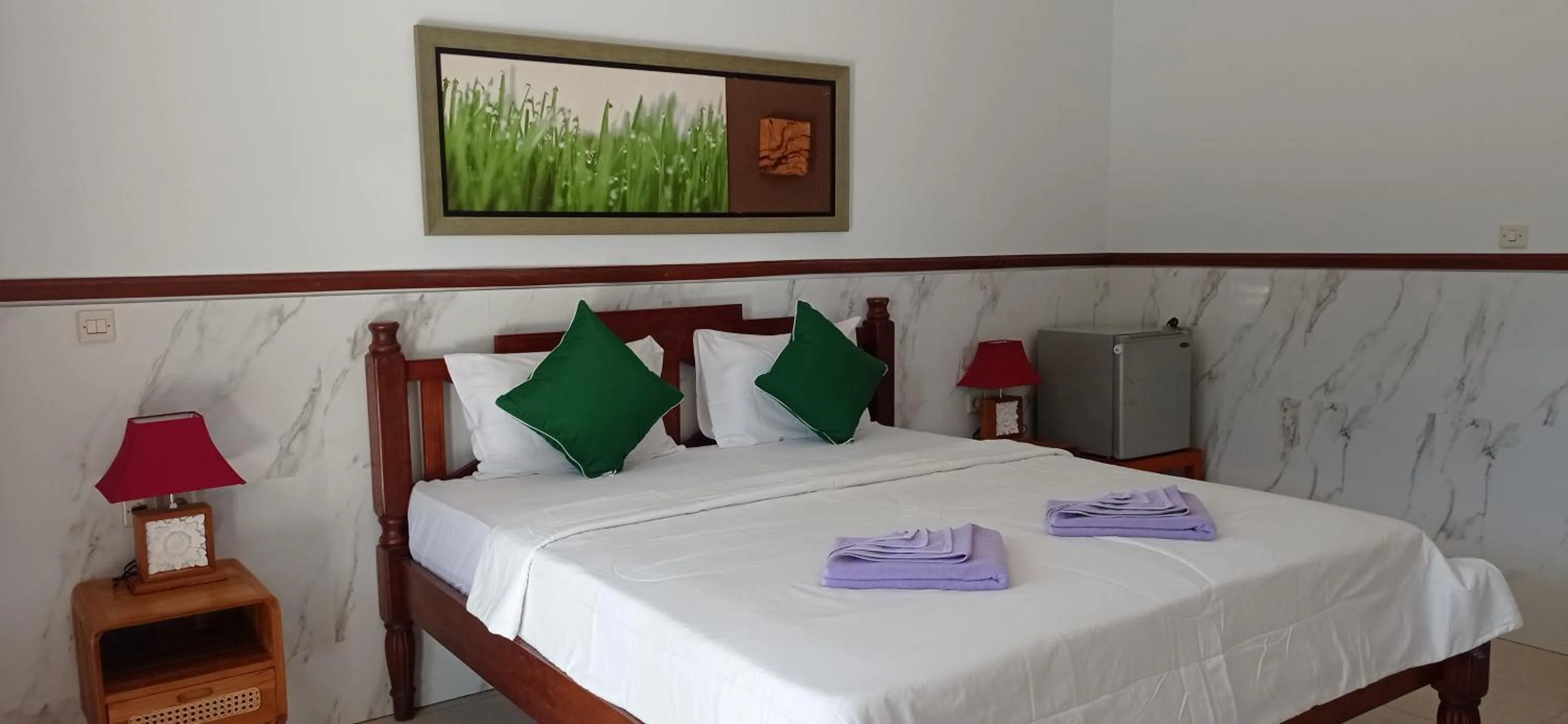 Bed in khrisna Bungalow Tulamben