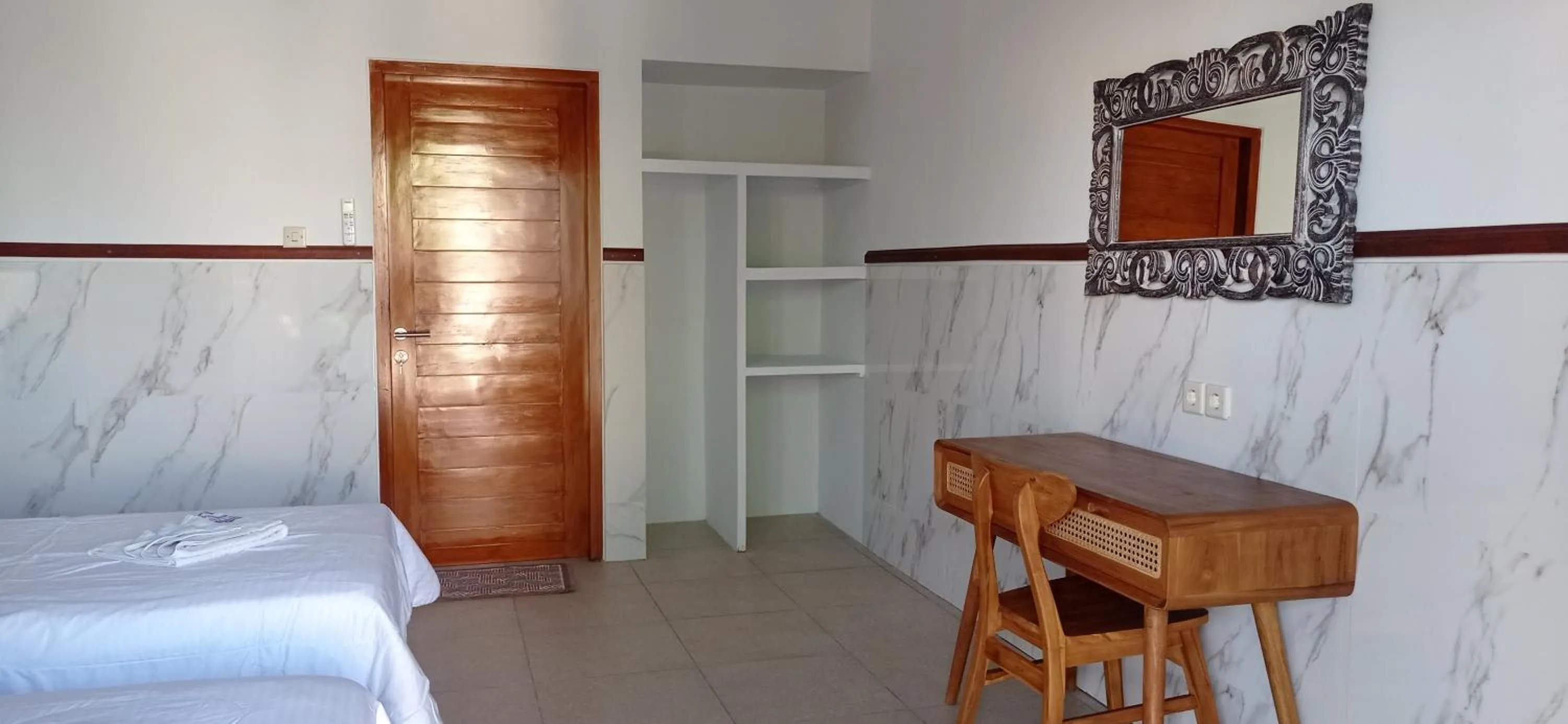 Bed in khrisna Bungalow Tulamben