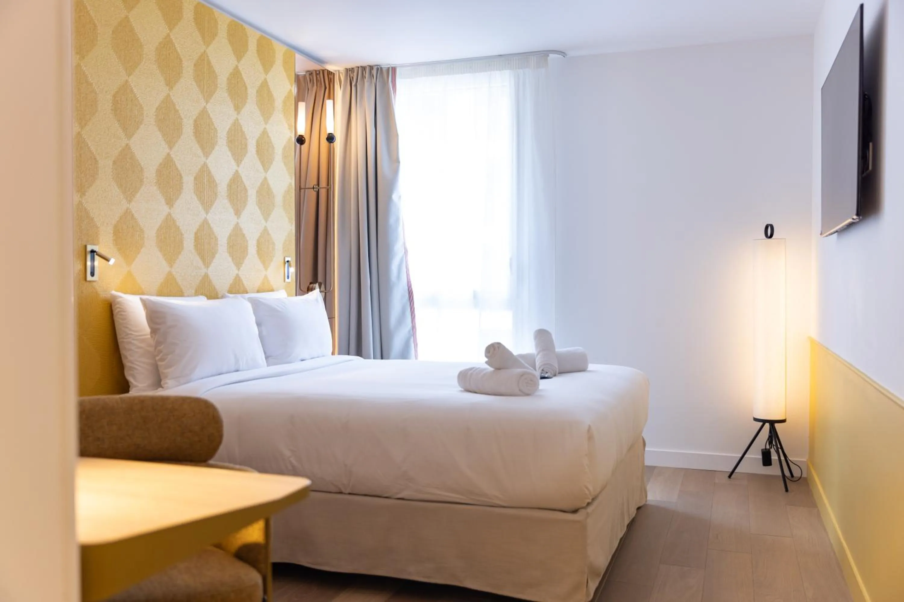 Bed in Hôtel Kyriad Prestige Paris Asnieres