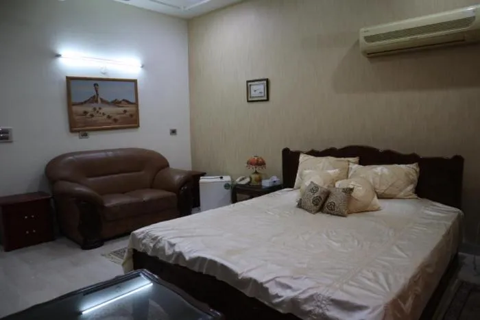 Bed in PRITHVI FARM COTTAGE AND VILLA