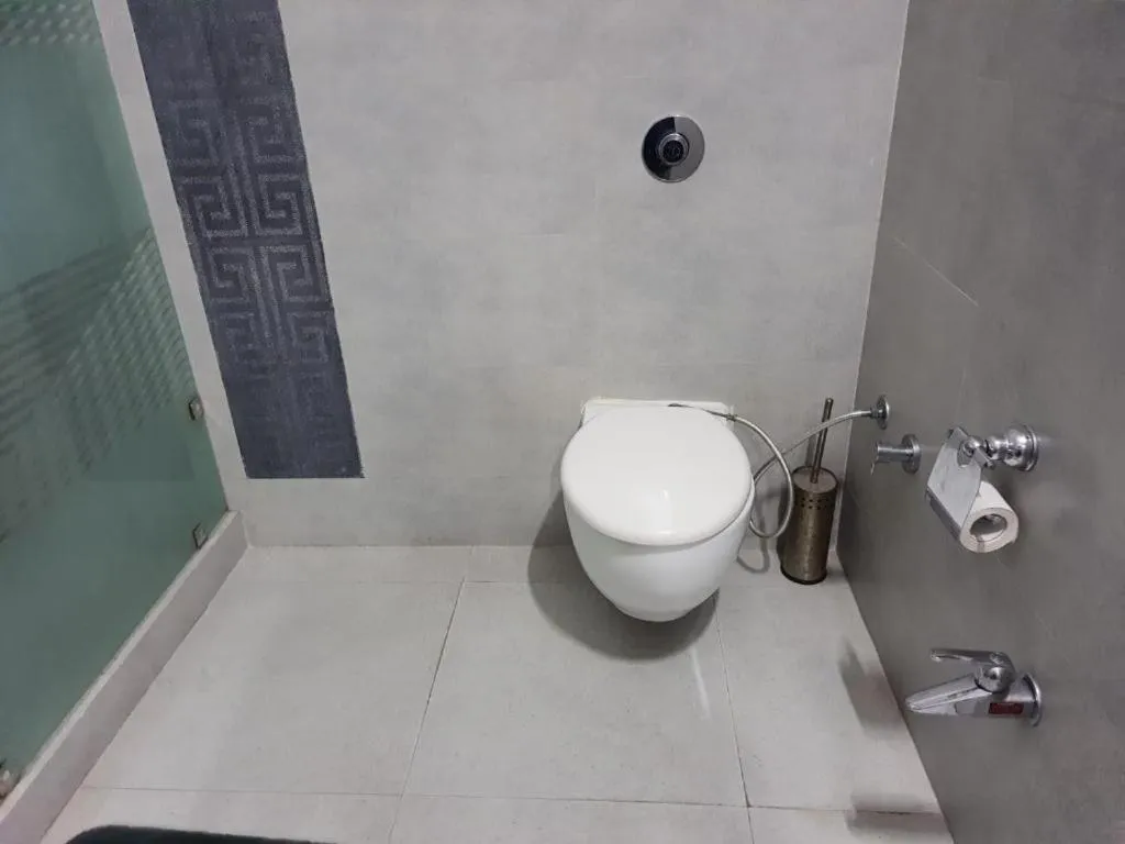 Shower in PRITHVI FARM COTTAGE AND VILLA