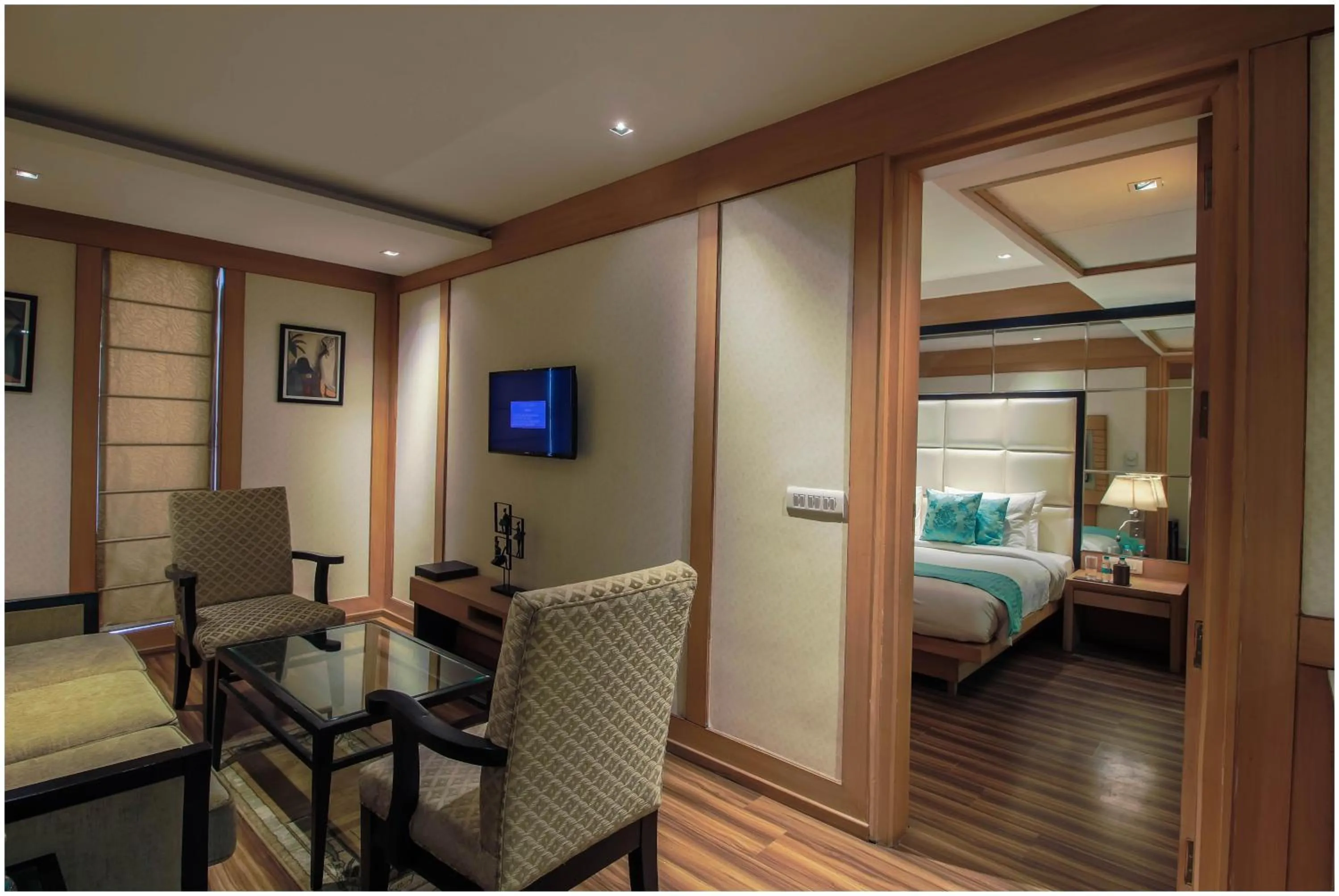 Living room, Bed in The Nikunj Hotels