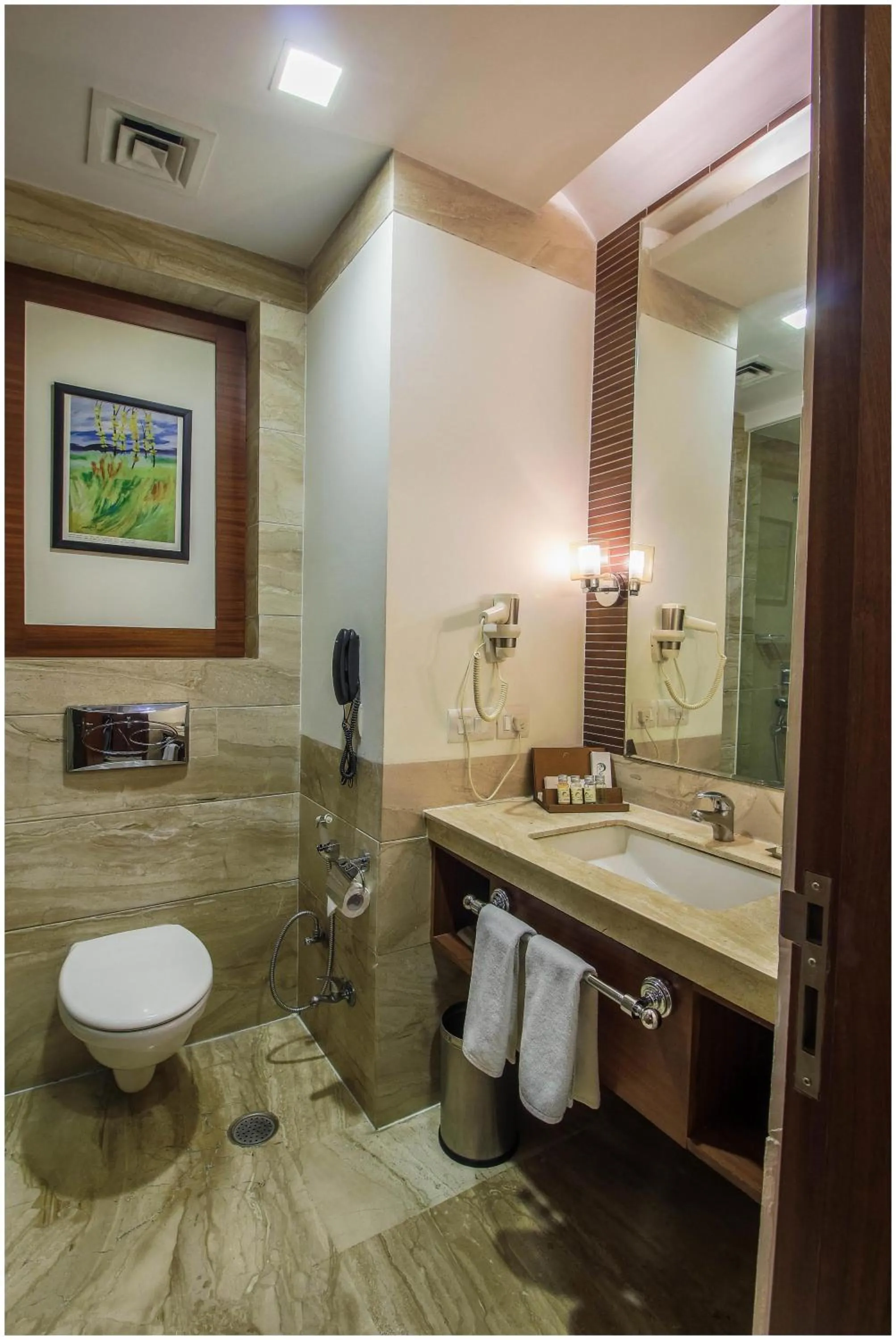 Bathroom in The Nikunj Hotels