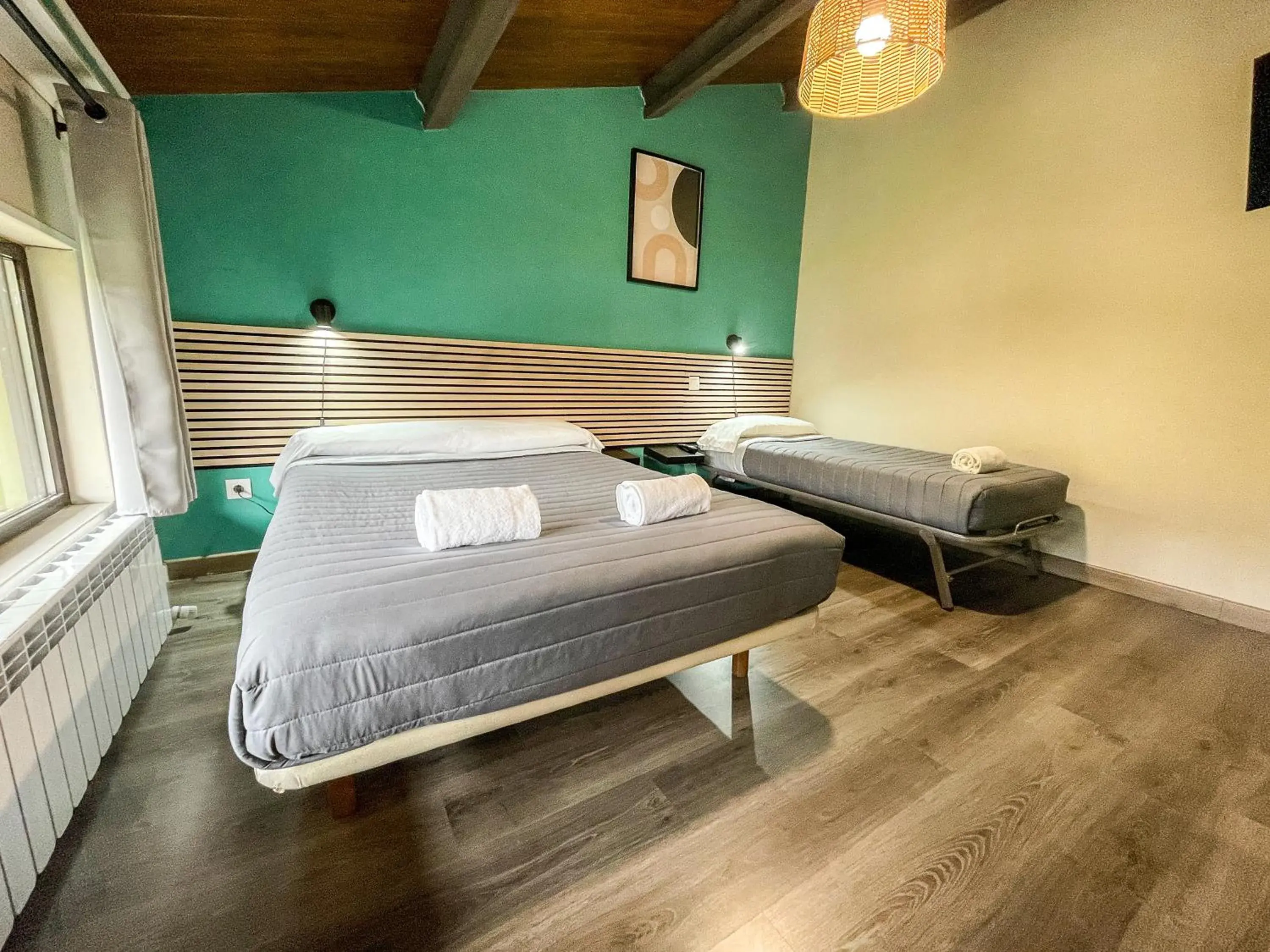 Triple Room in SOLOPUENT Hotel Rural Triple Room in SOLOPUENT Hotel Rural