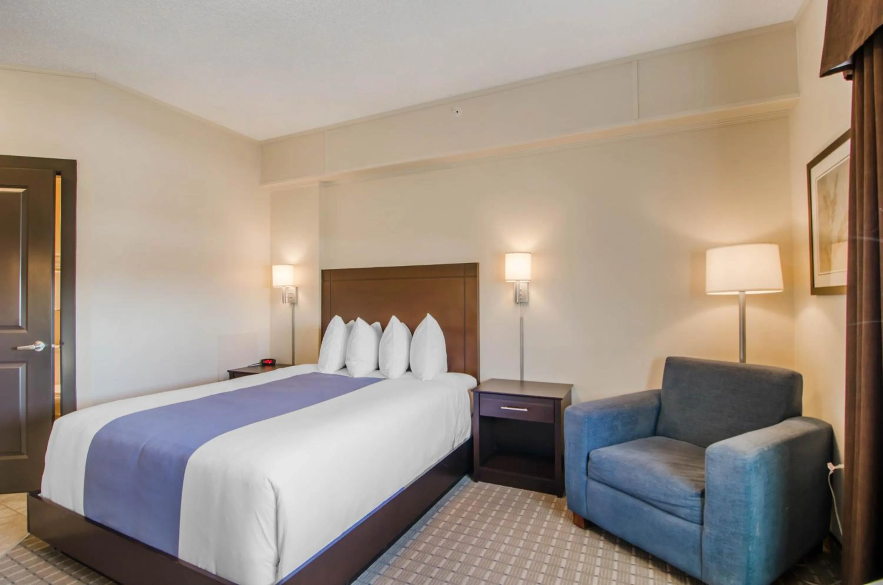 Bed in Kindersley All Suites Hotel