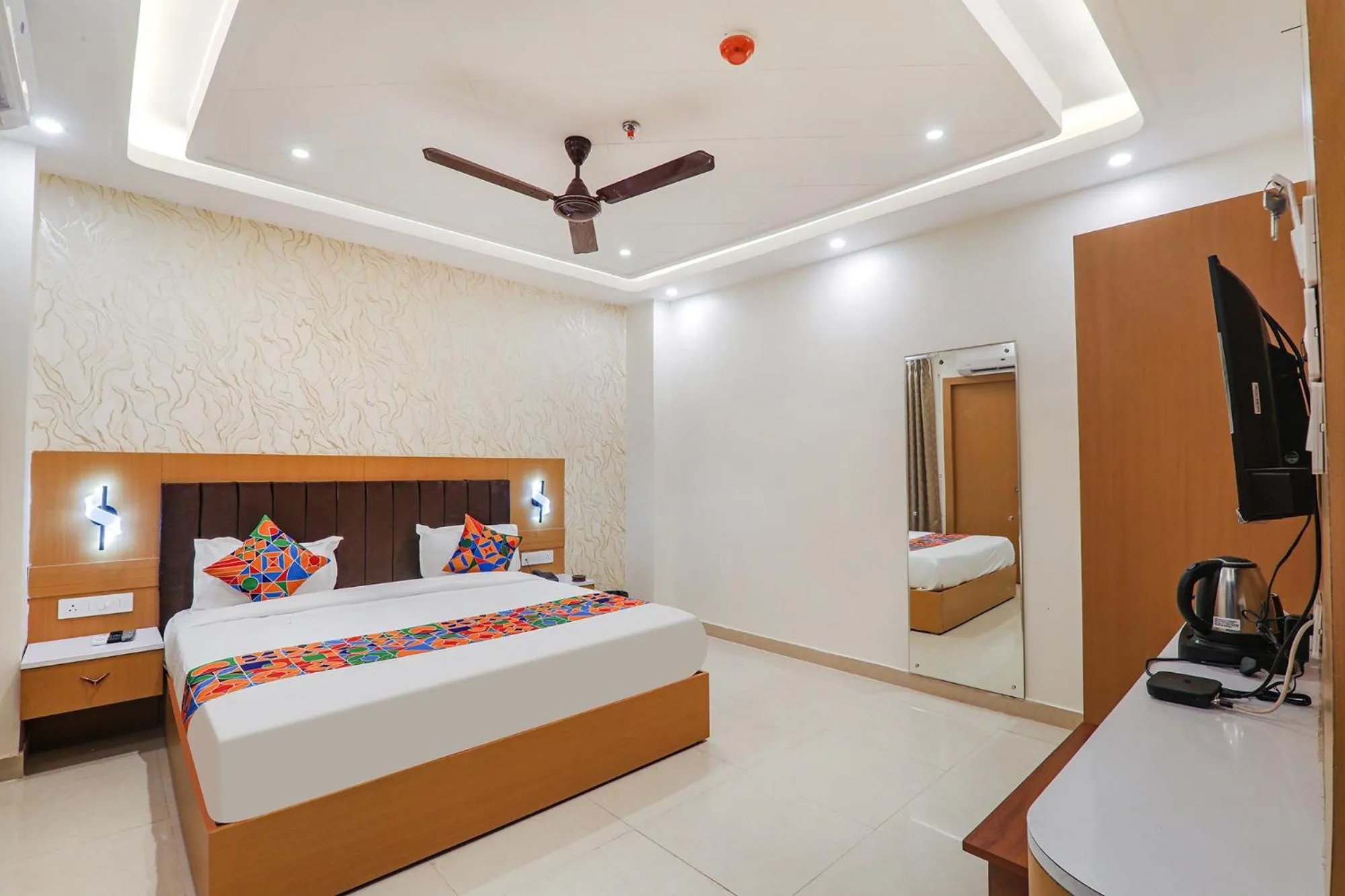 Bed in FabHotel Raj Palace