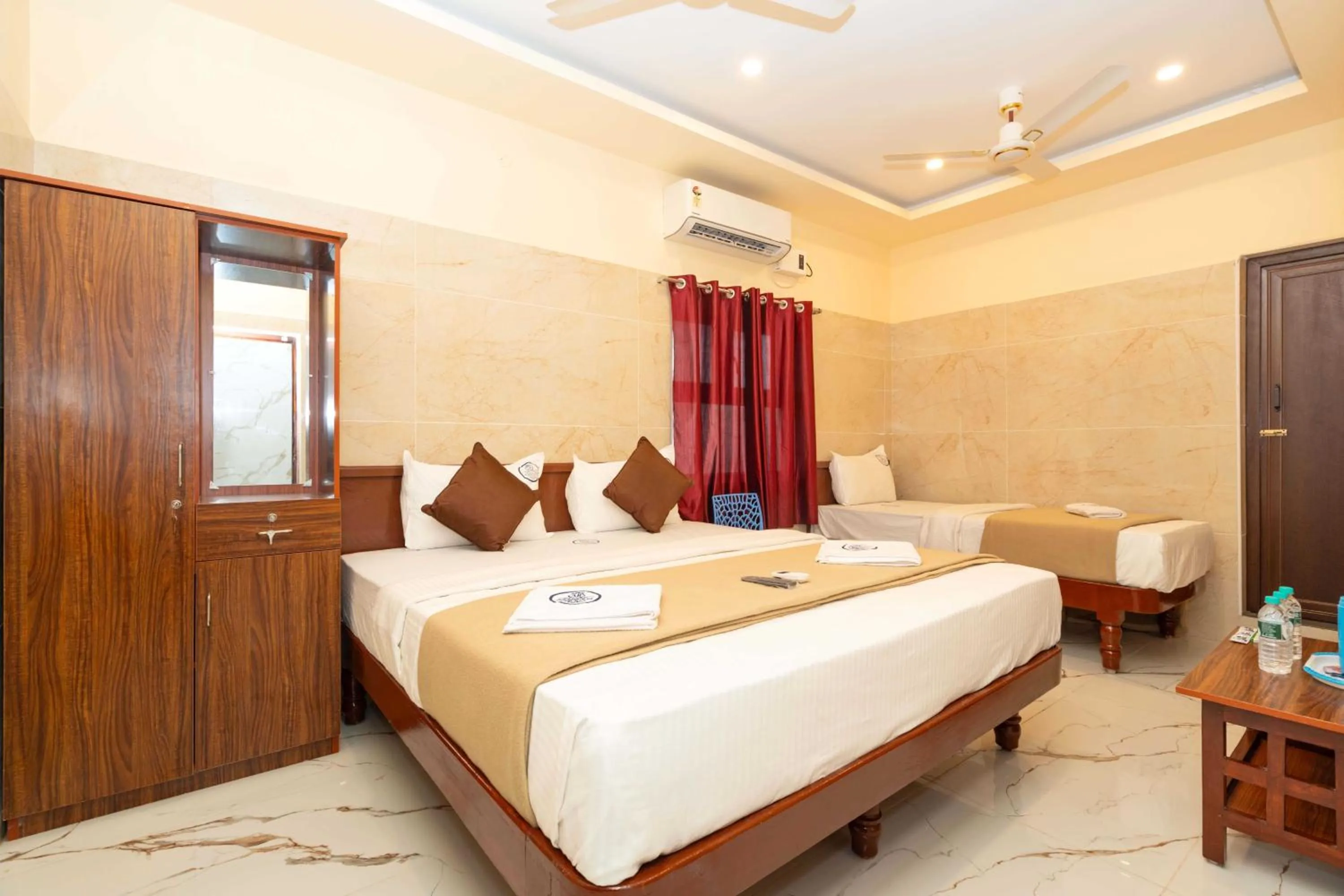 Photo of the whole room, Bed in Amman Residency - Rameswaram