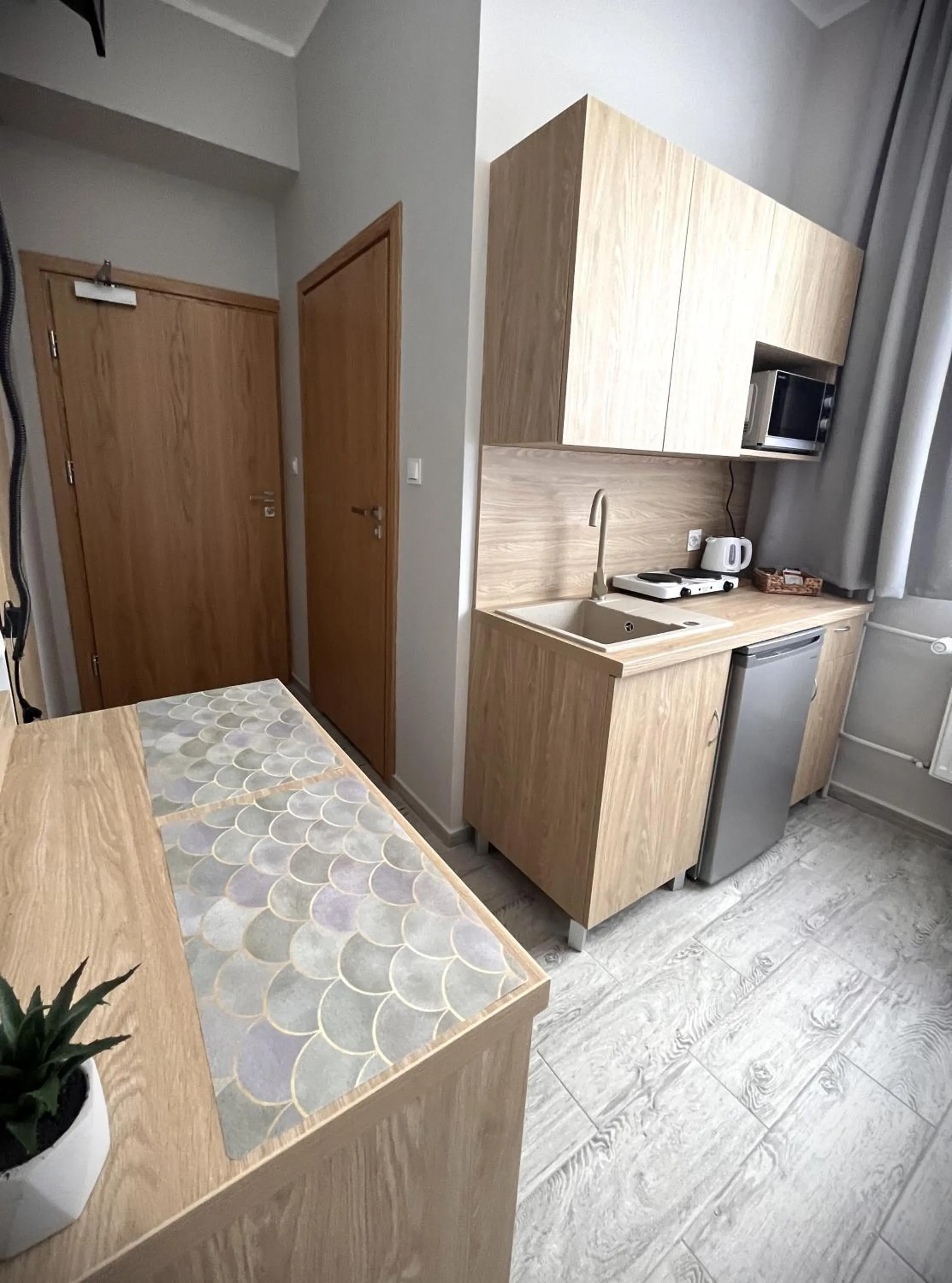 Kitchen or kitchenette, Bed in Apartamenty Wilczyńskiego