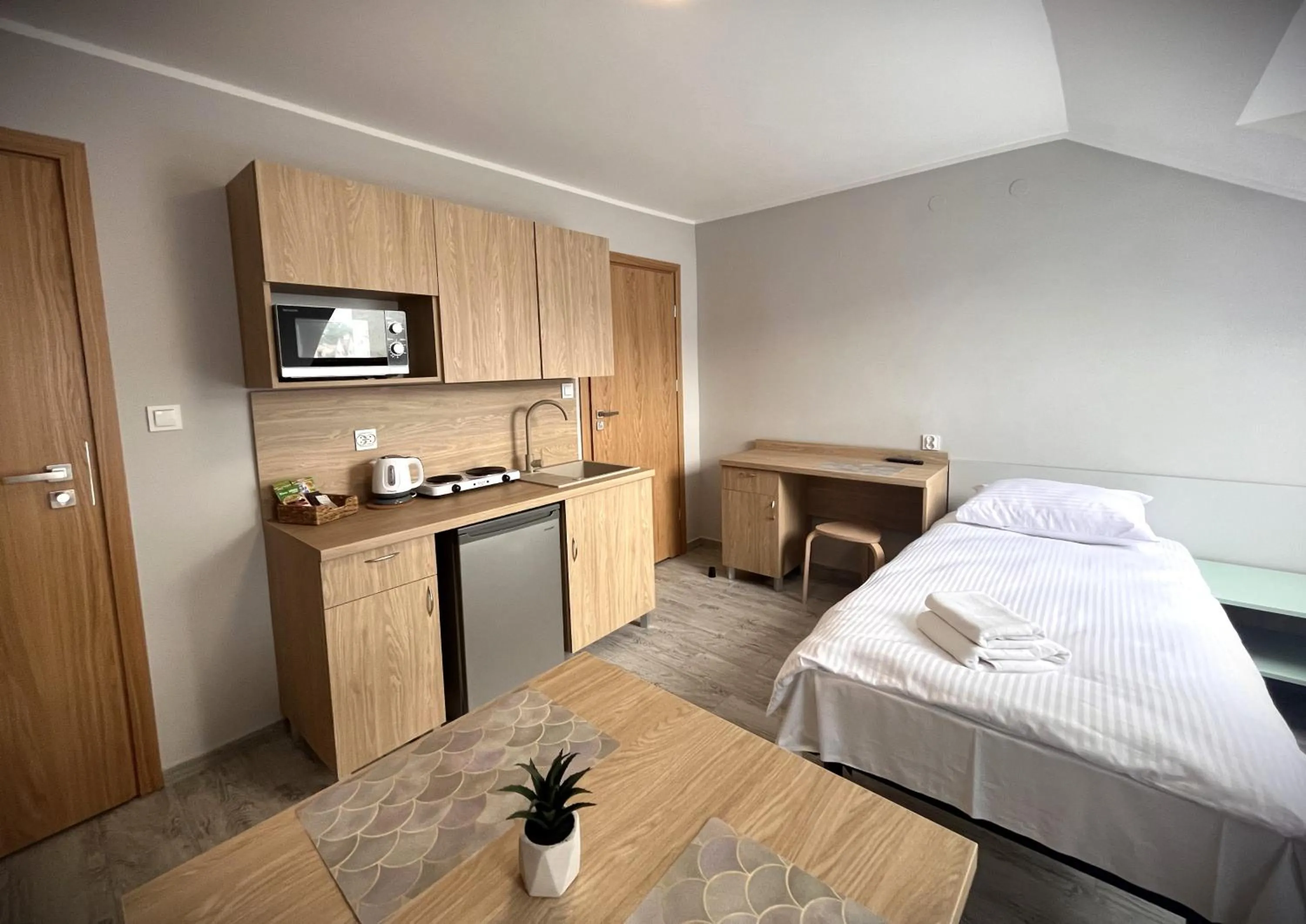Kitchen or kitchenette, Bed in Apartamenty Wilczyńskiego
