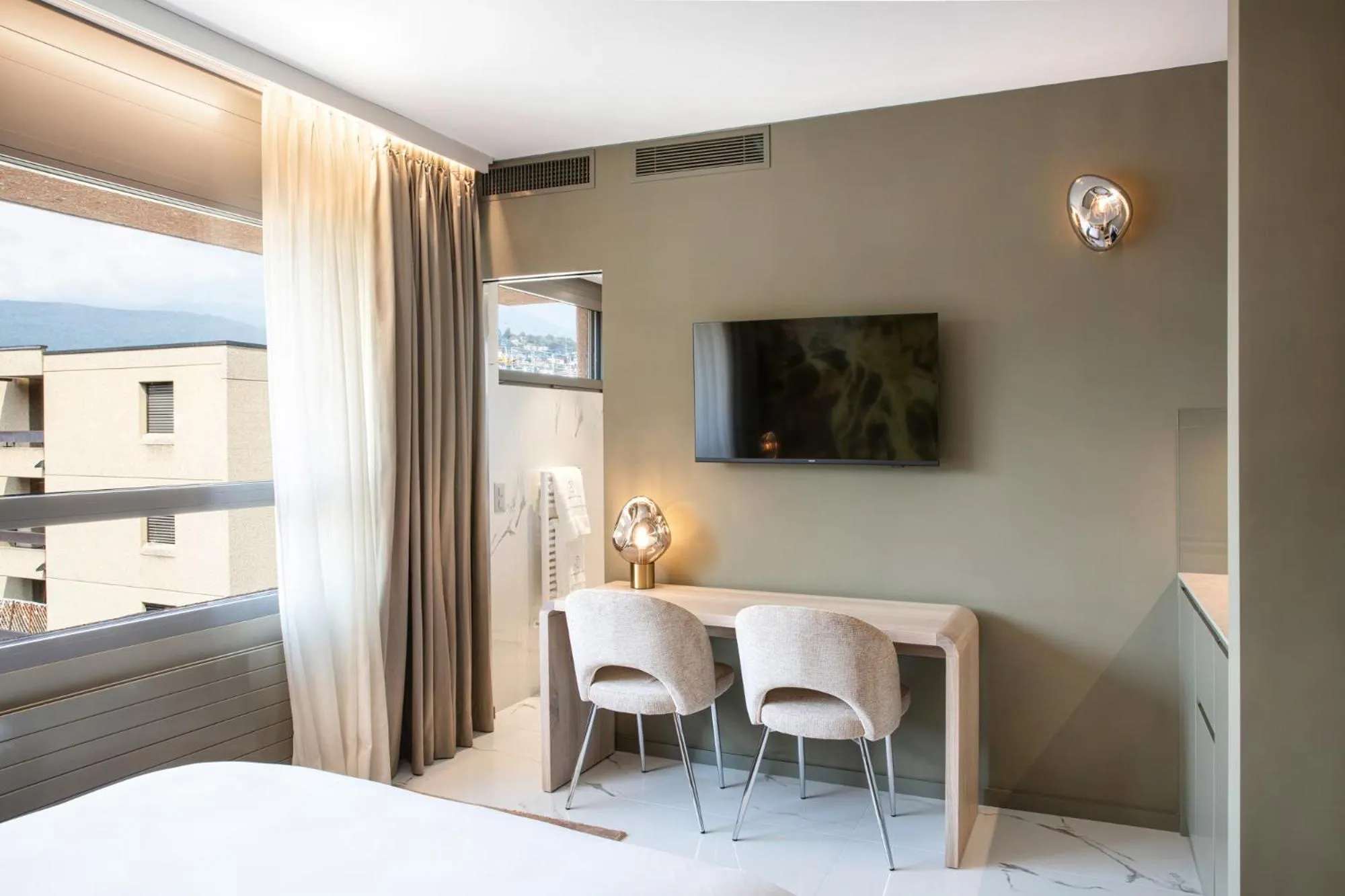 Living room, Bed in VISIONAPARTMENTS Lugano - contactless check-in