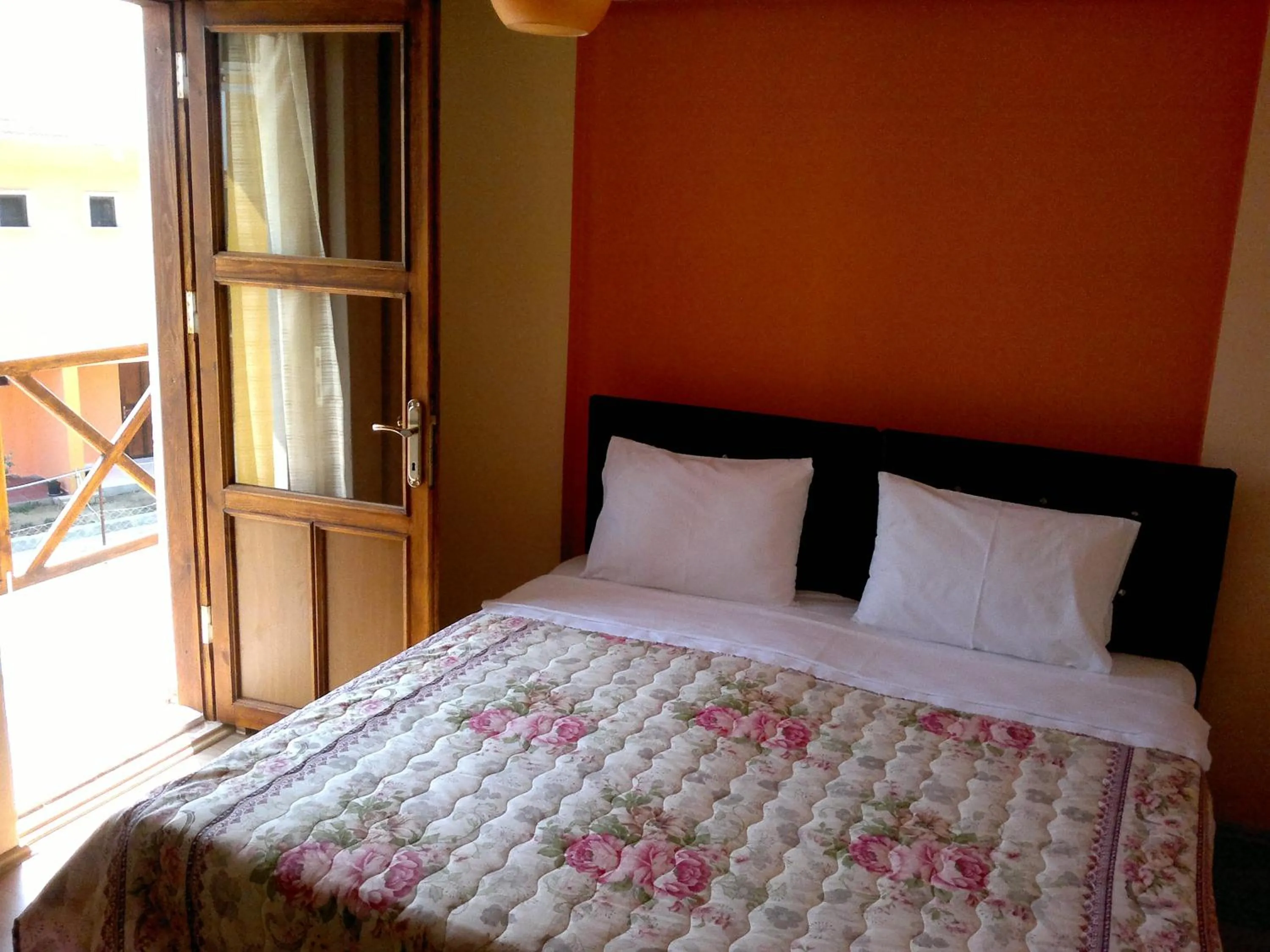 Bed in Kalanora Resort Hotel