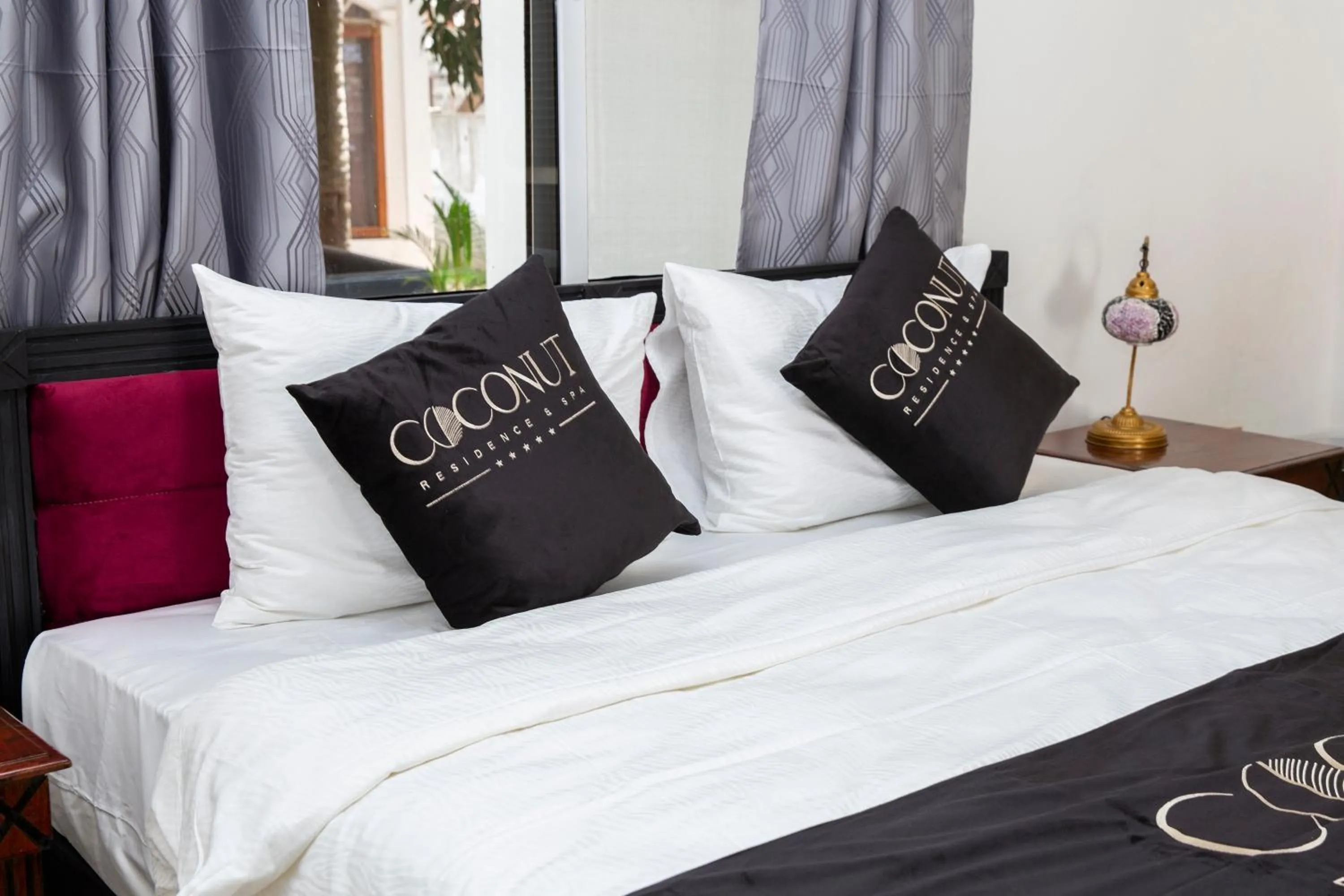 Property logo or sign, Bed in Coconut Residence & Spa