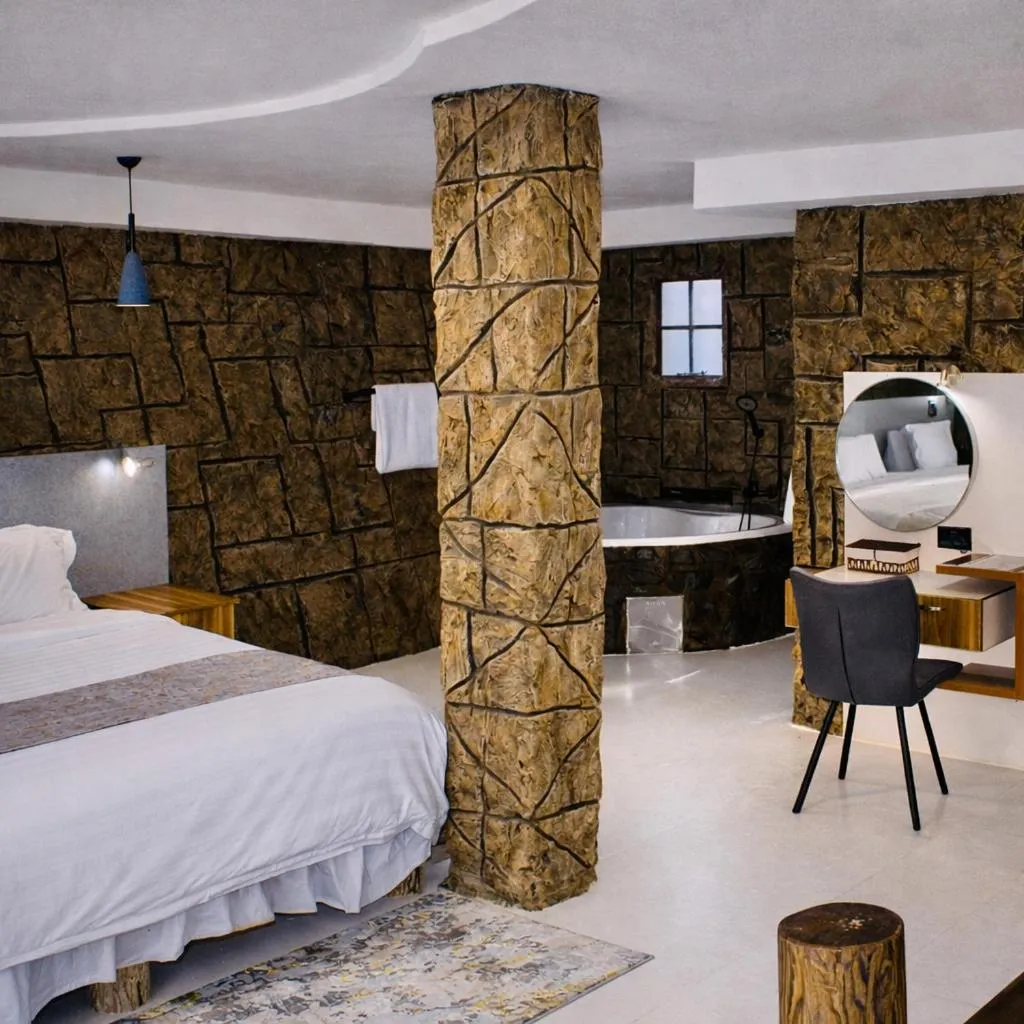 Bed in Rustiek Hotel