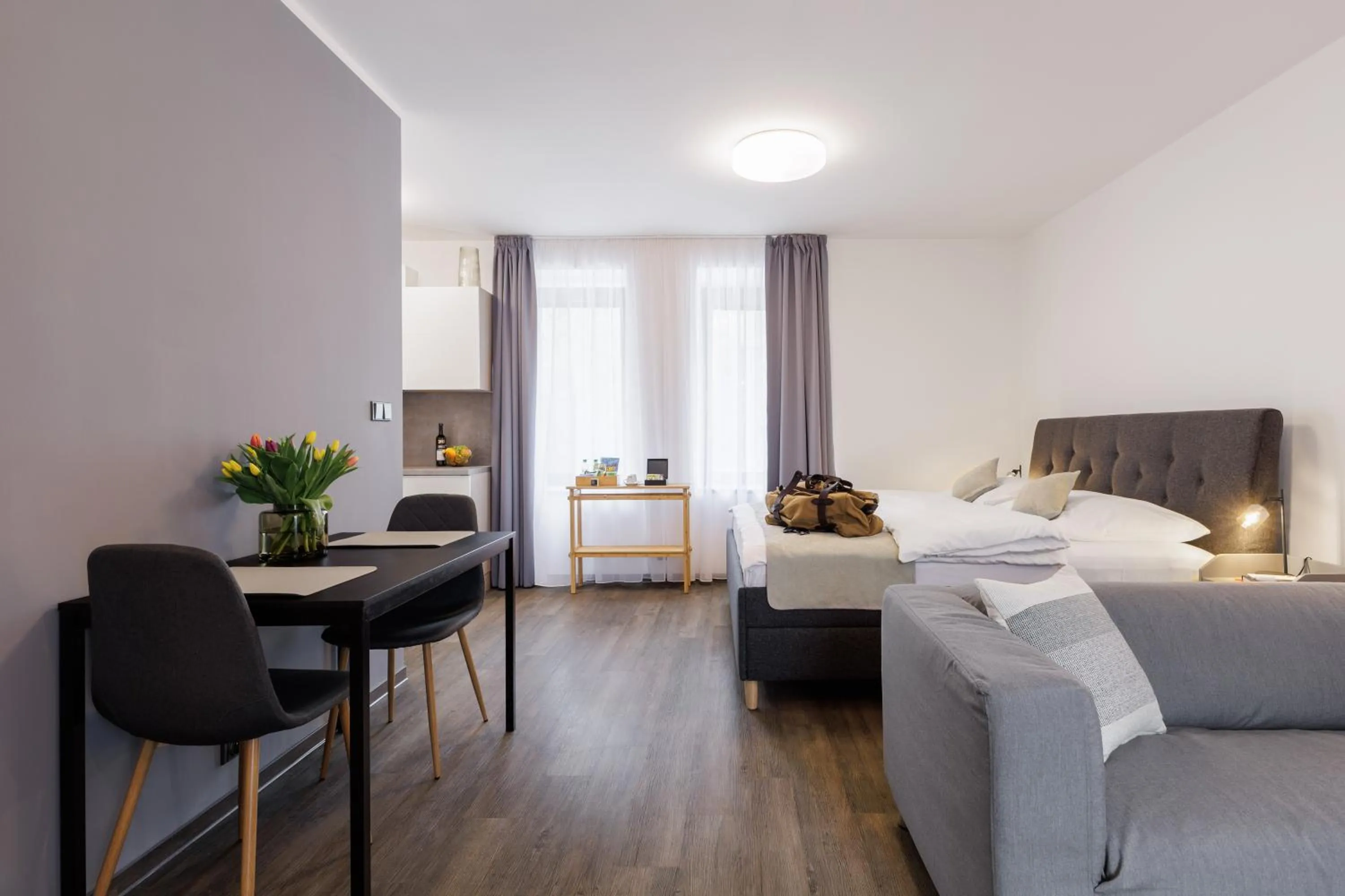 Living room, Bed in River Apartments