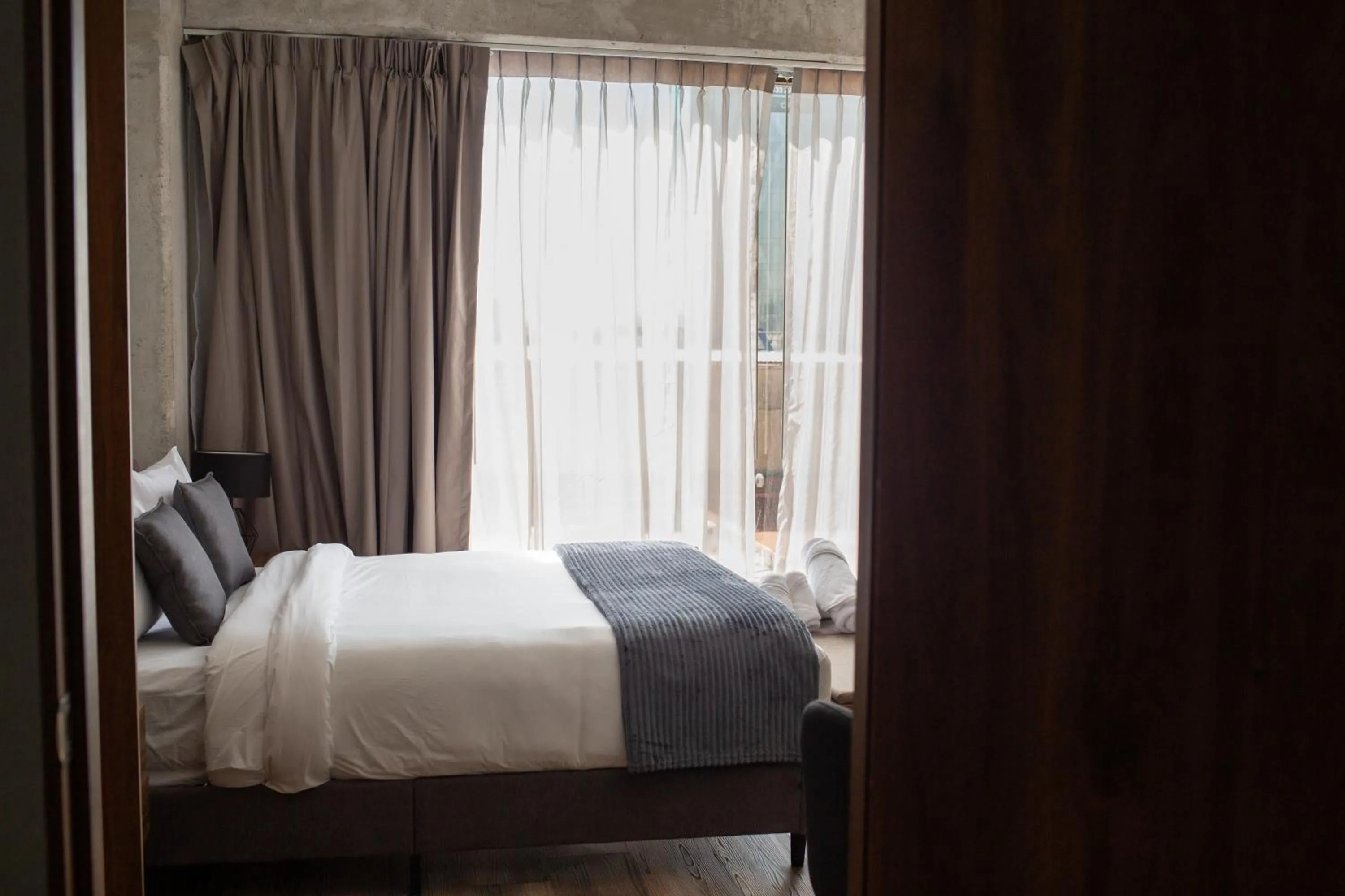 Bed in Suites del Carmen Consulado