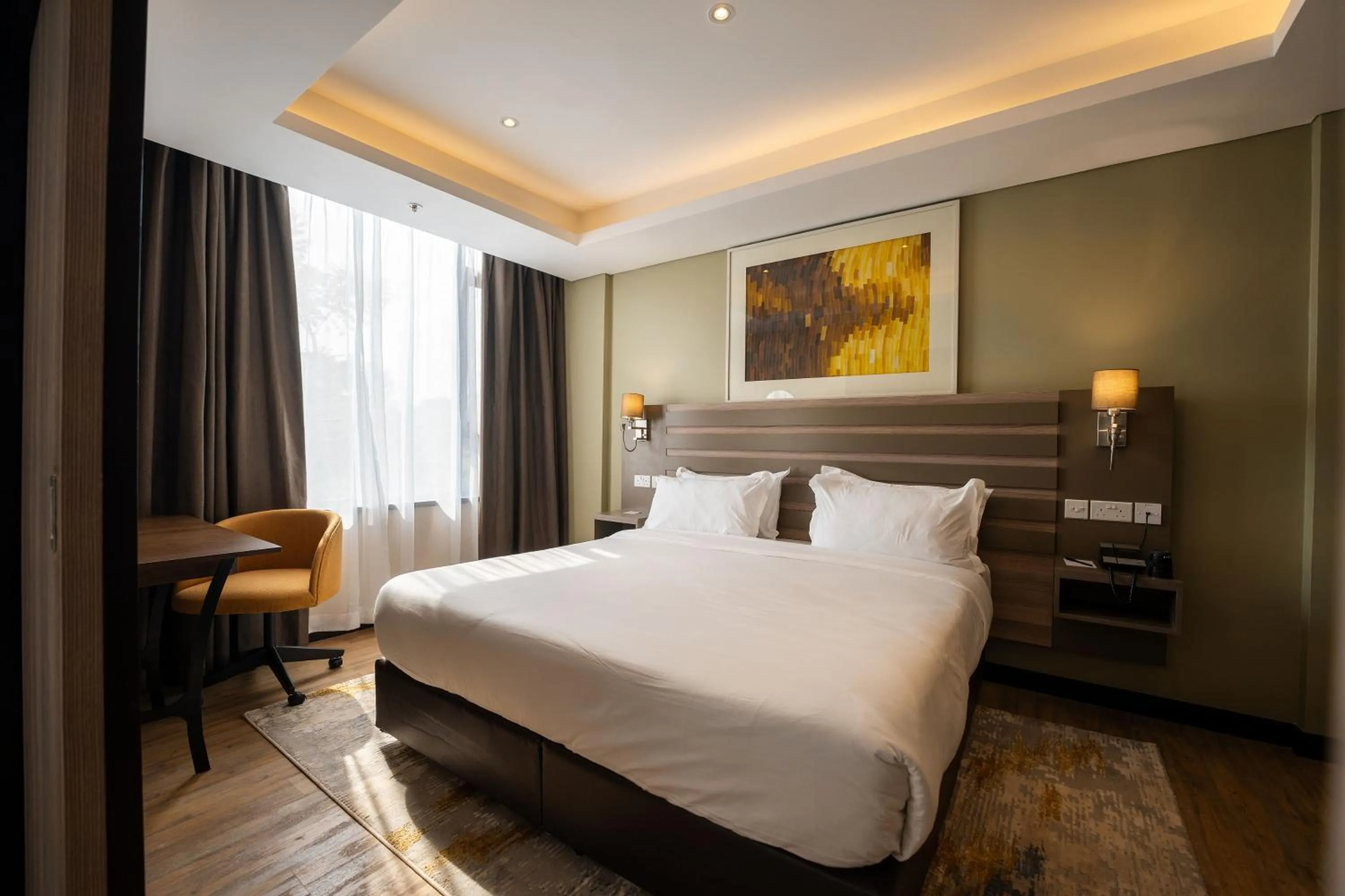 Bedroom, Bed in Trademark Suites at Enaki Town