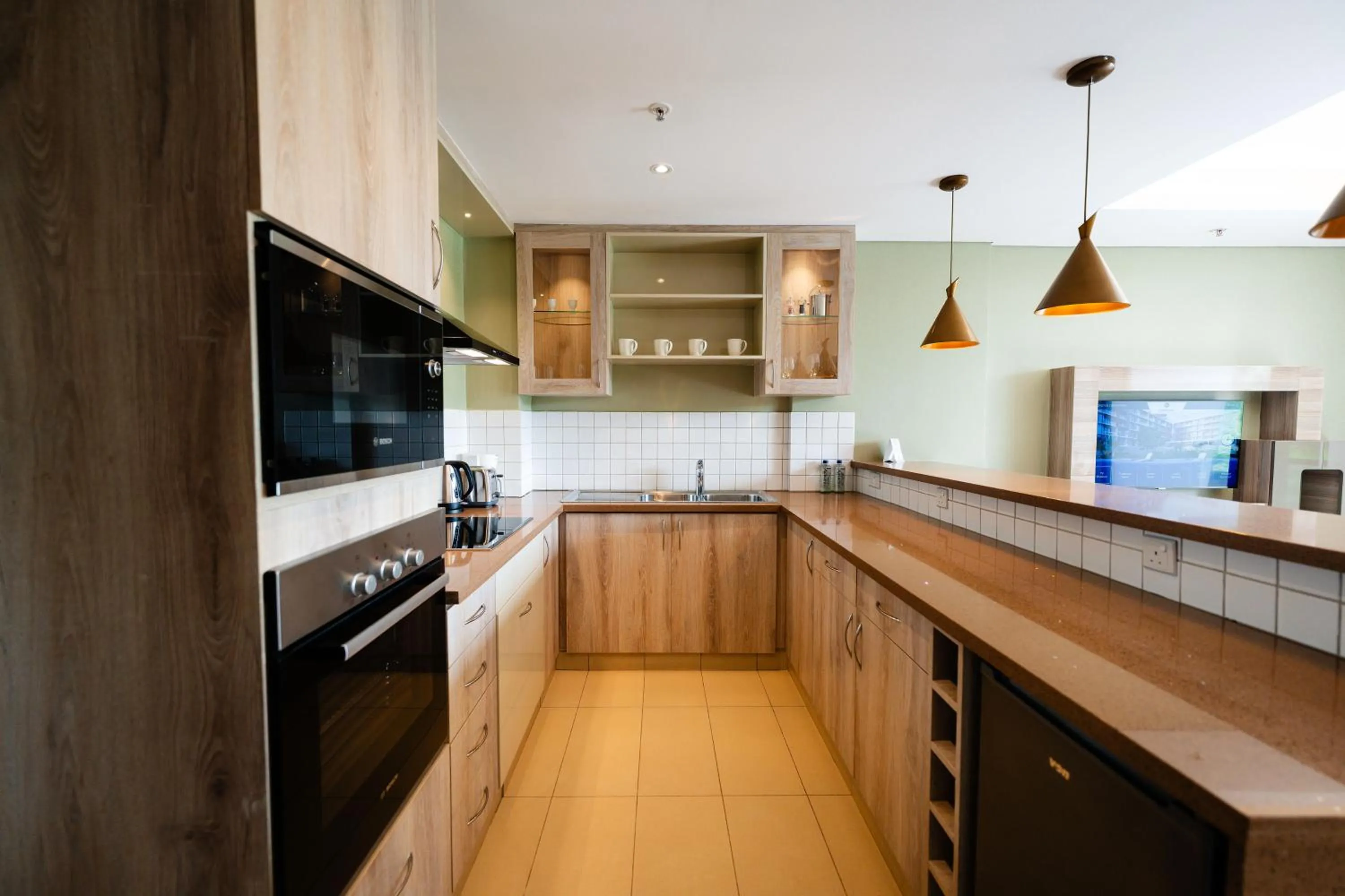 kitchen in Trademark Suites at Enaki Town