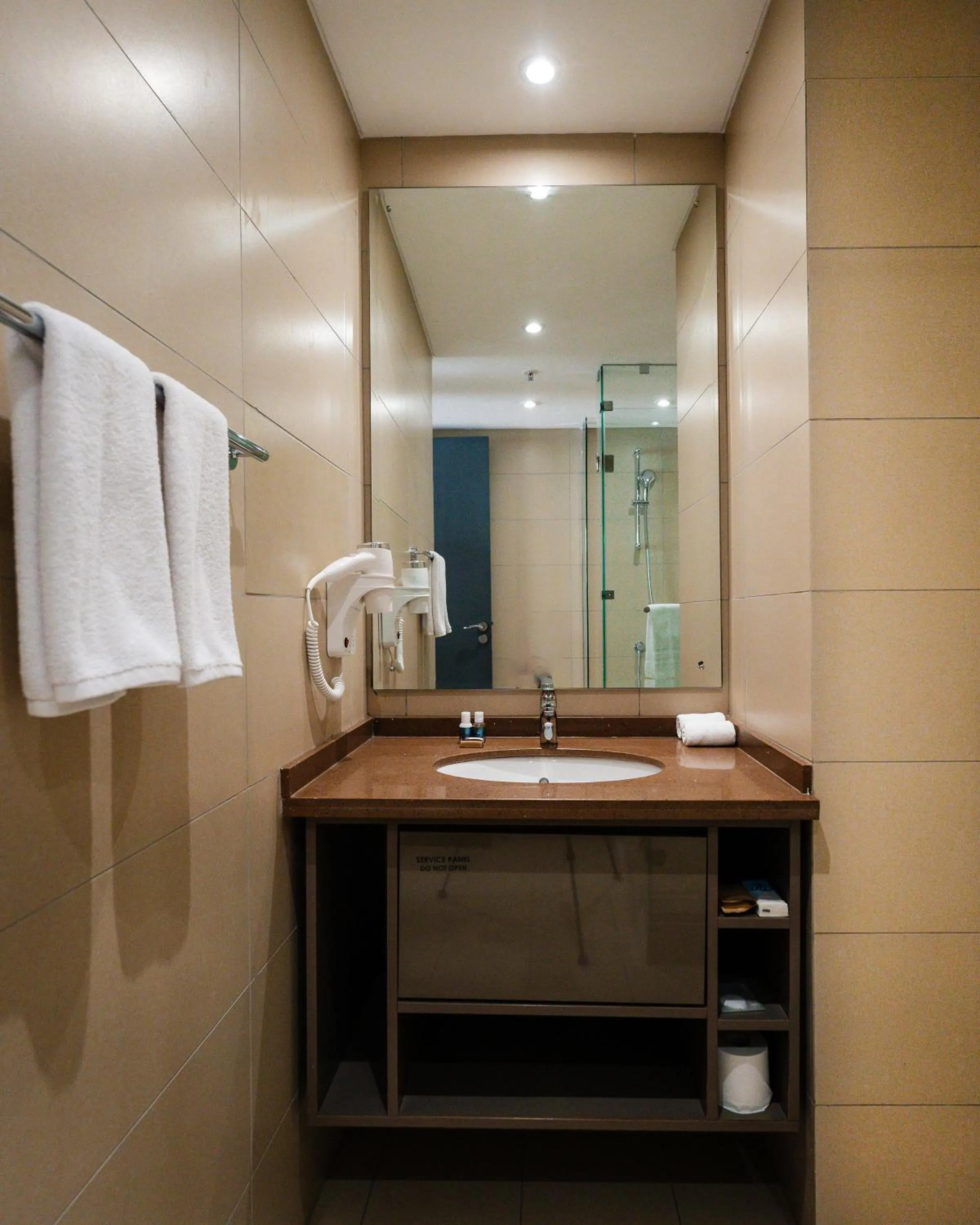 Bathroom in Trademark Suites at Enaki Town