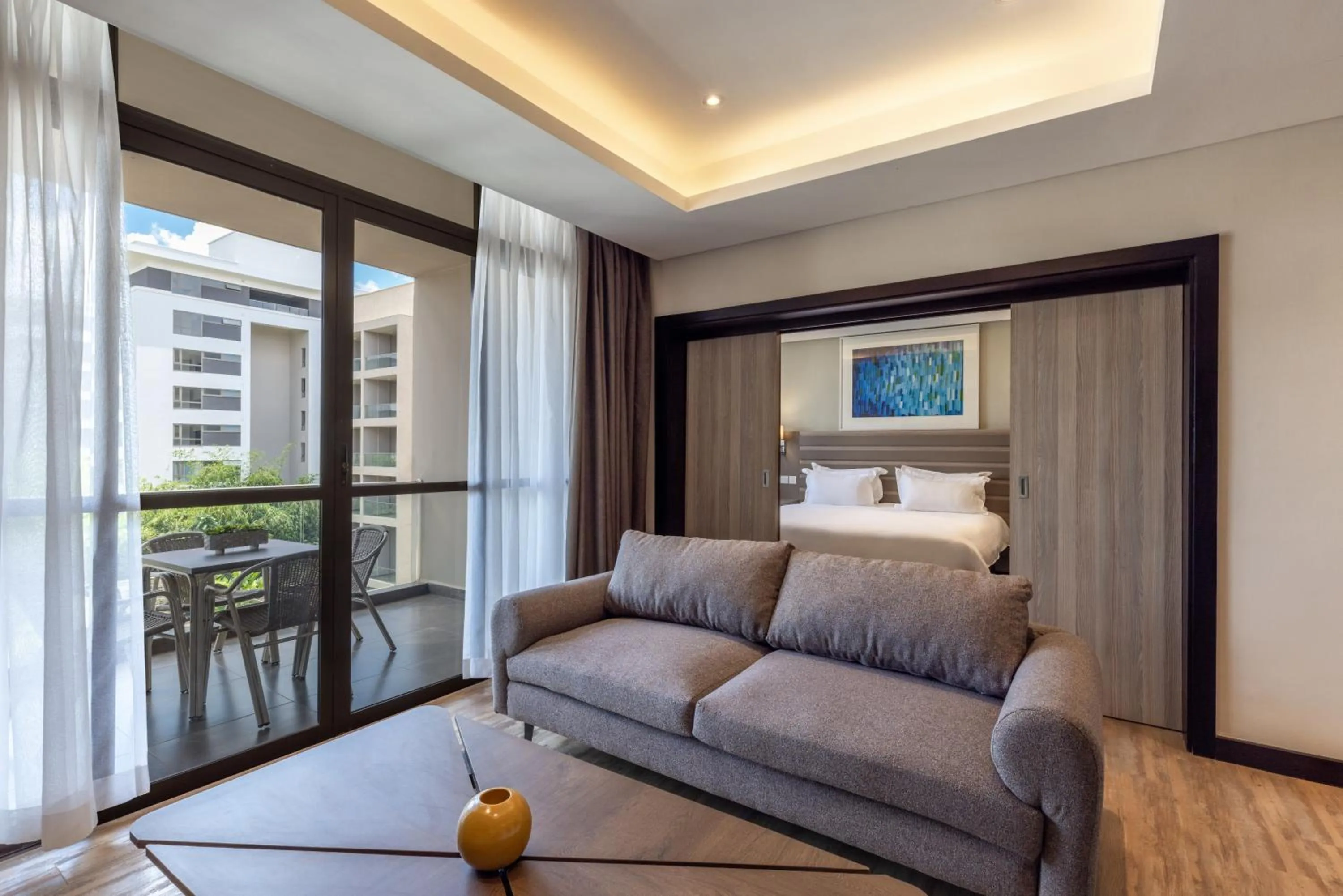 Photo of the whole room, Bed in Trademark Suites at Enaki Town