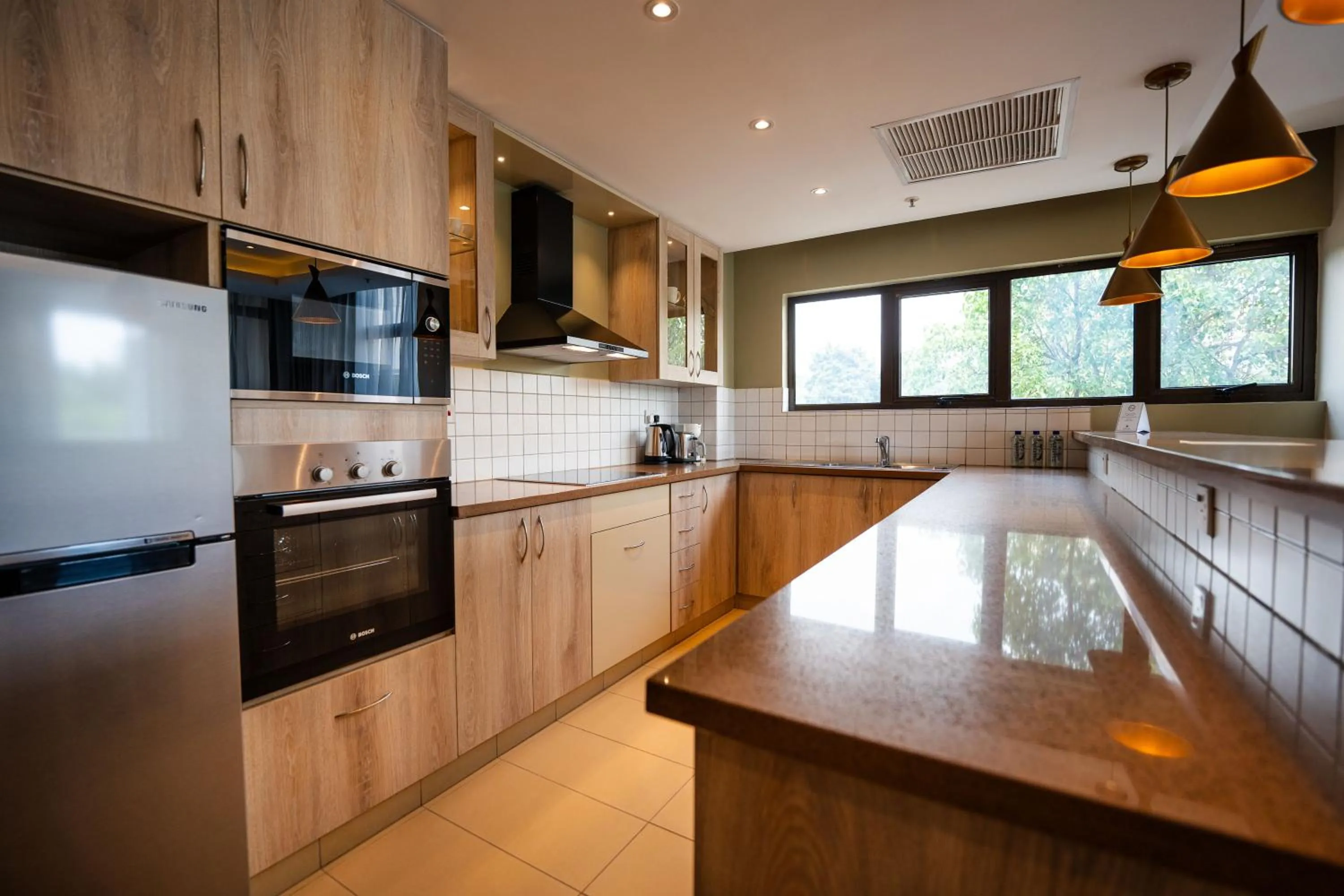 kitchen in Trademark Suites at Enaki Town