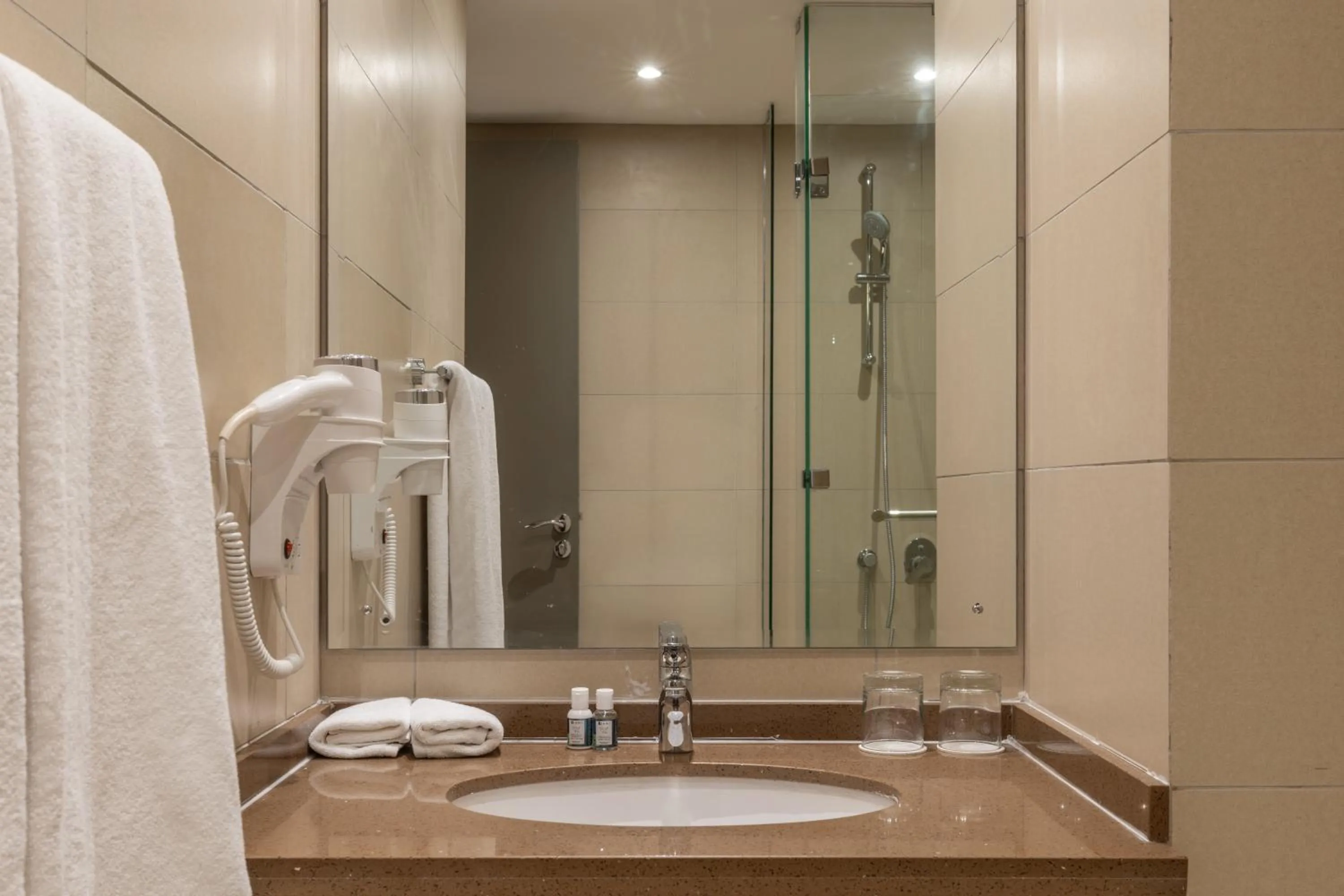 Bathroom in Trademark Suites at Enaki Town