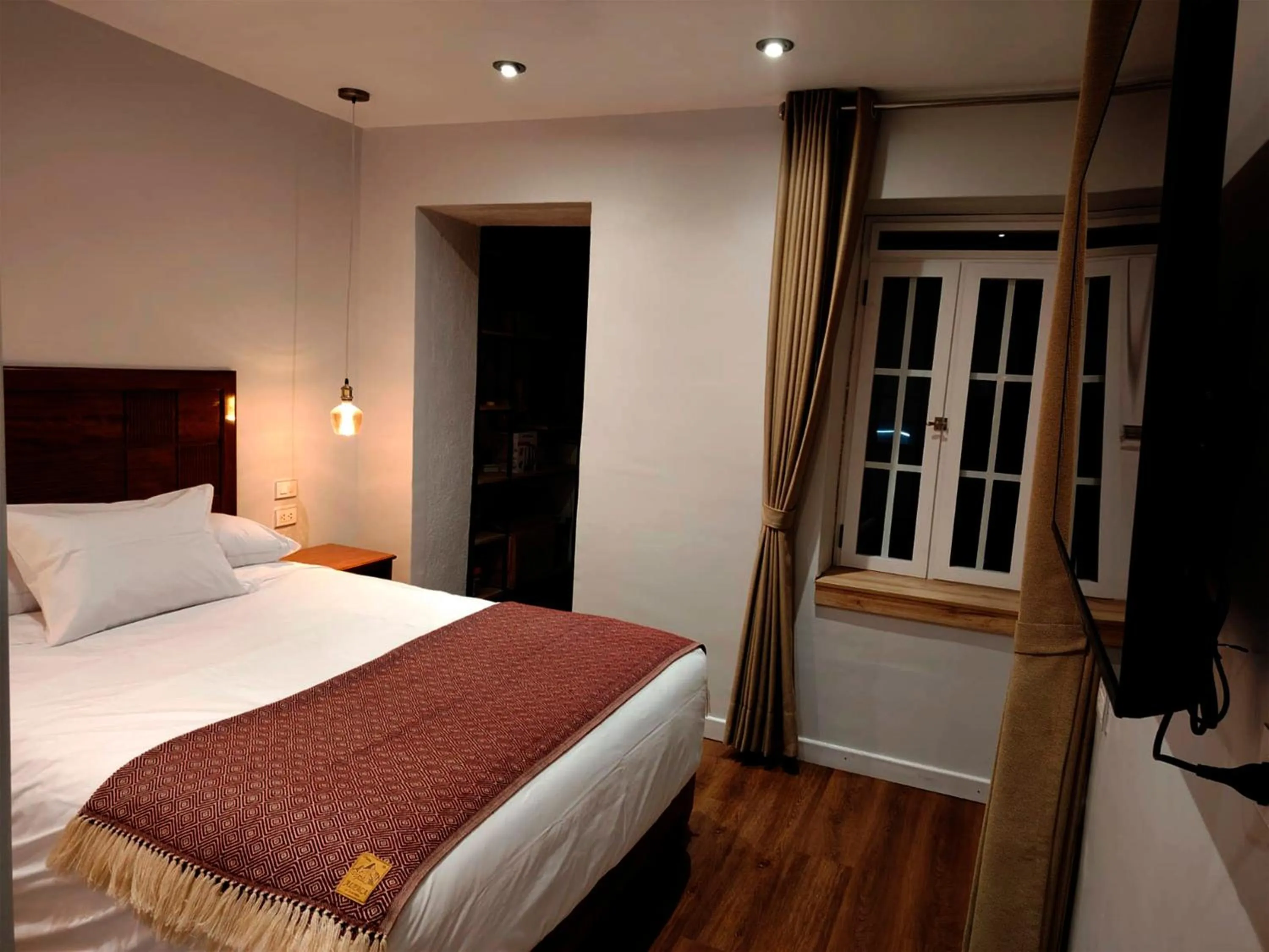 Bed in Casa Cruz Verde by Peru Garden Hotels