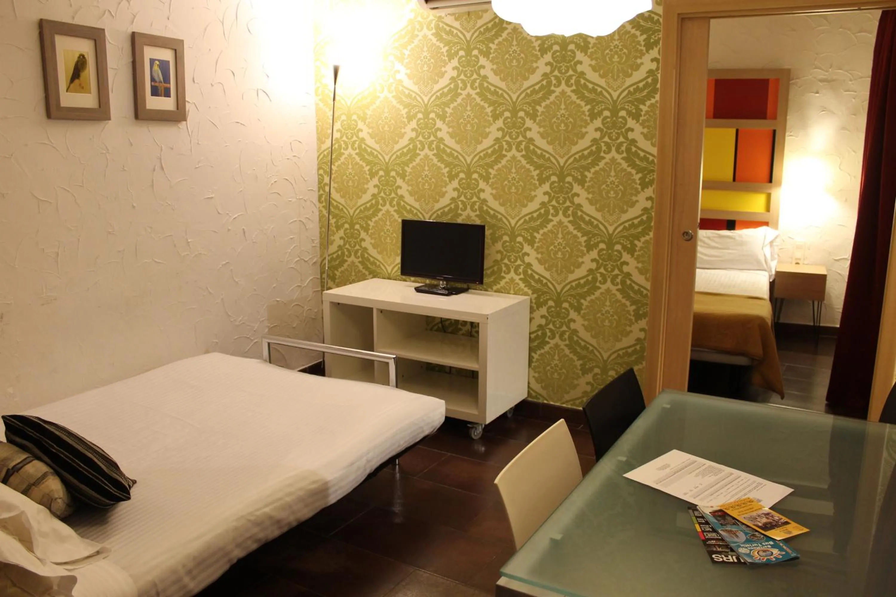 Living room, Bed in Apartaments Ciutat Vella