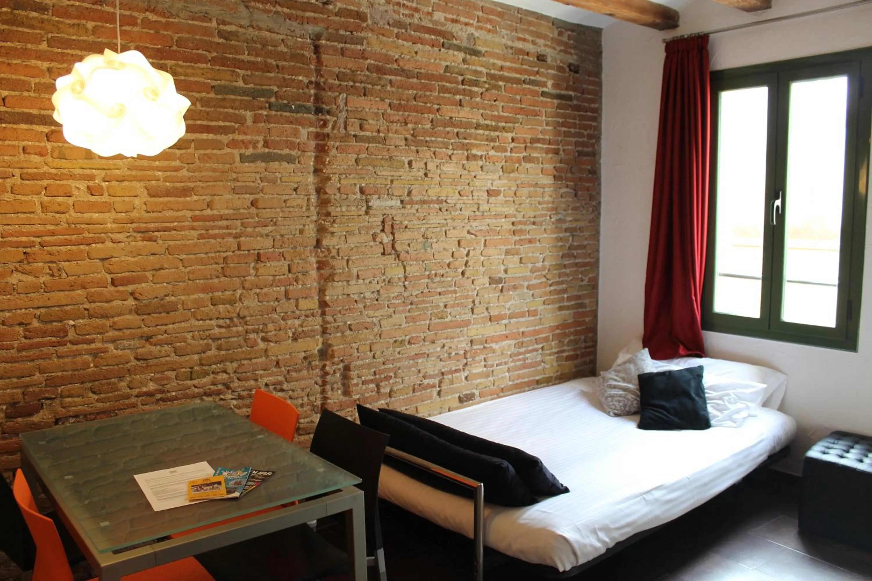 Living room, Bed in Apartaments Ciutat Vella