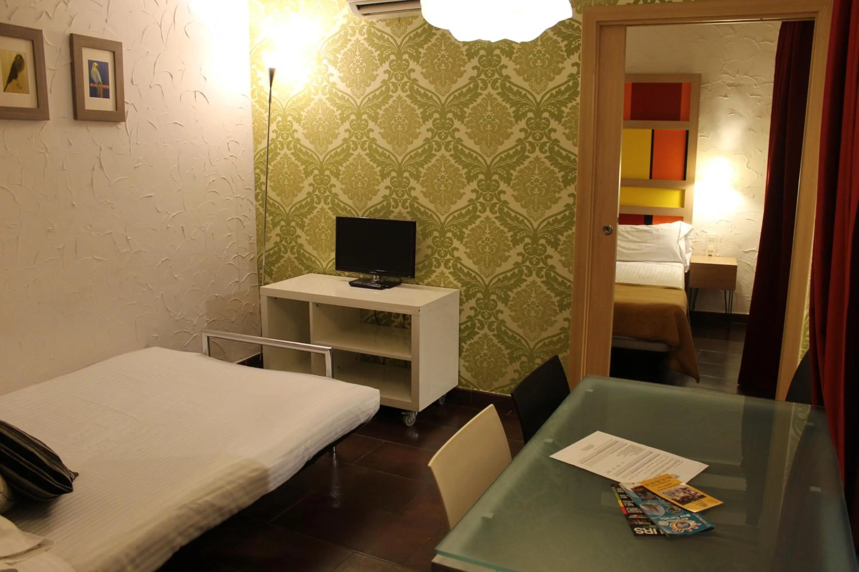 Living room, Bed in Apartaments Ciutat Vella