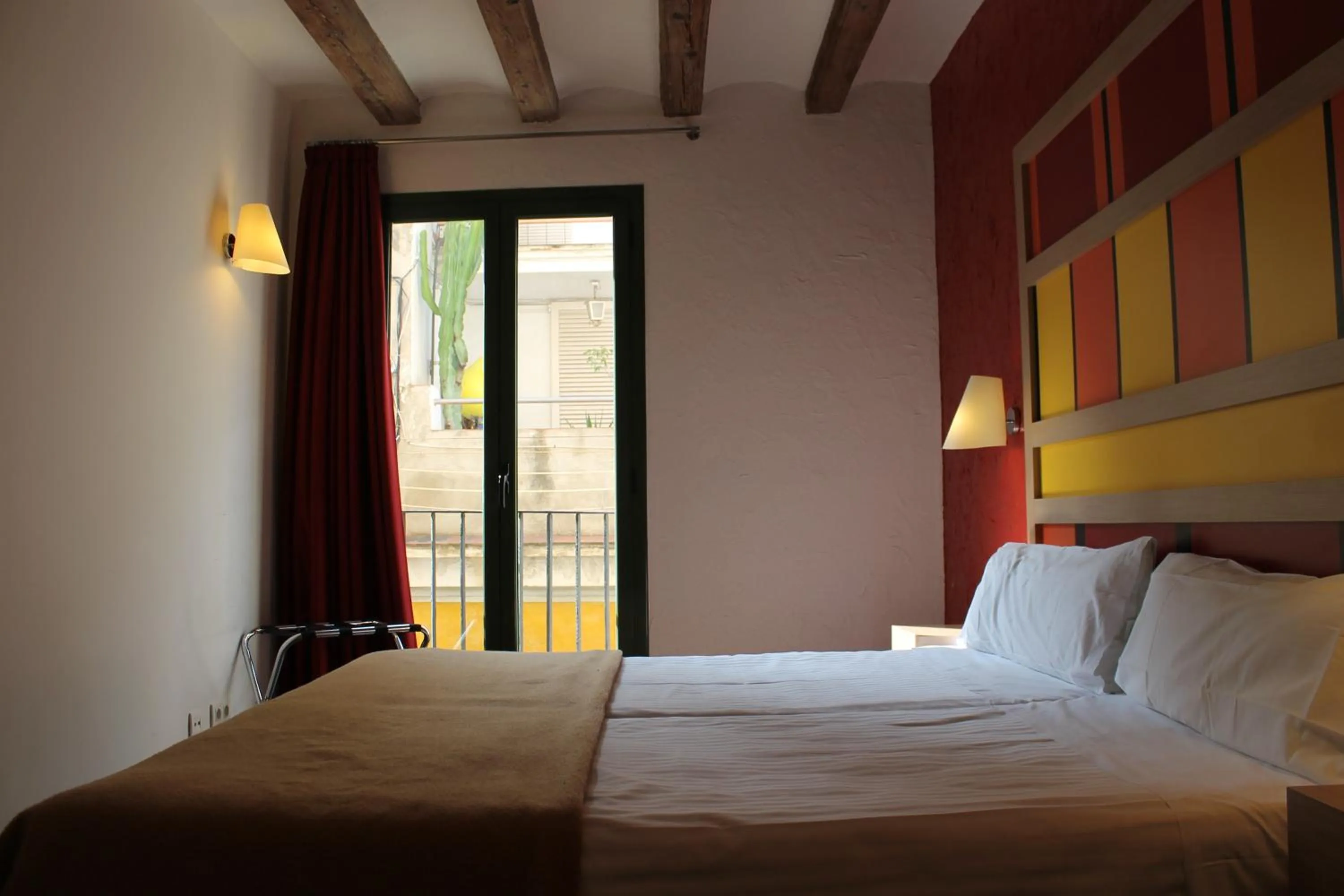 Bedroom, Bed in Apartaments Ciutat Vella