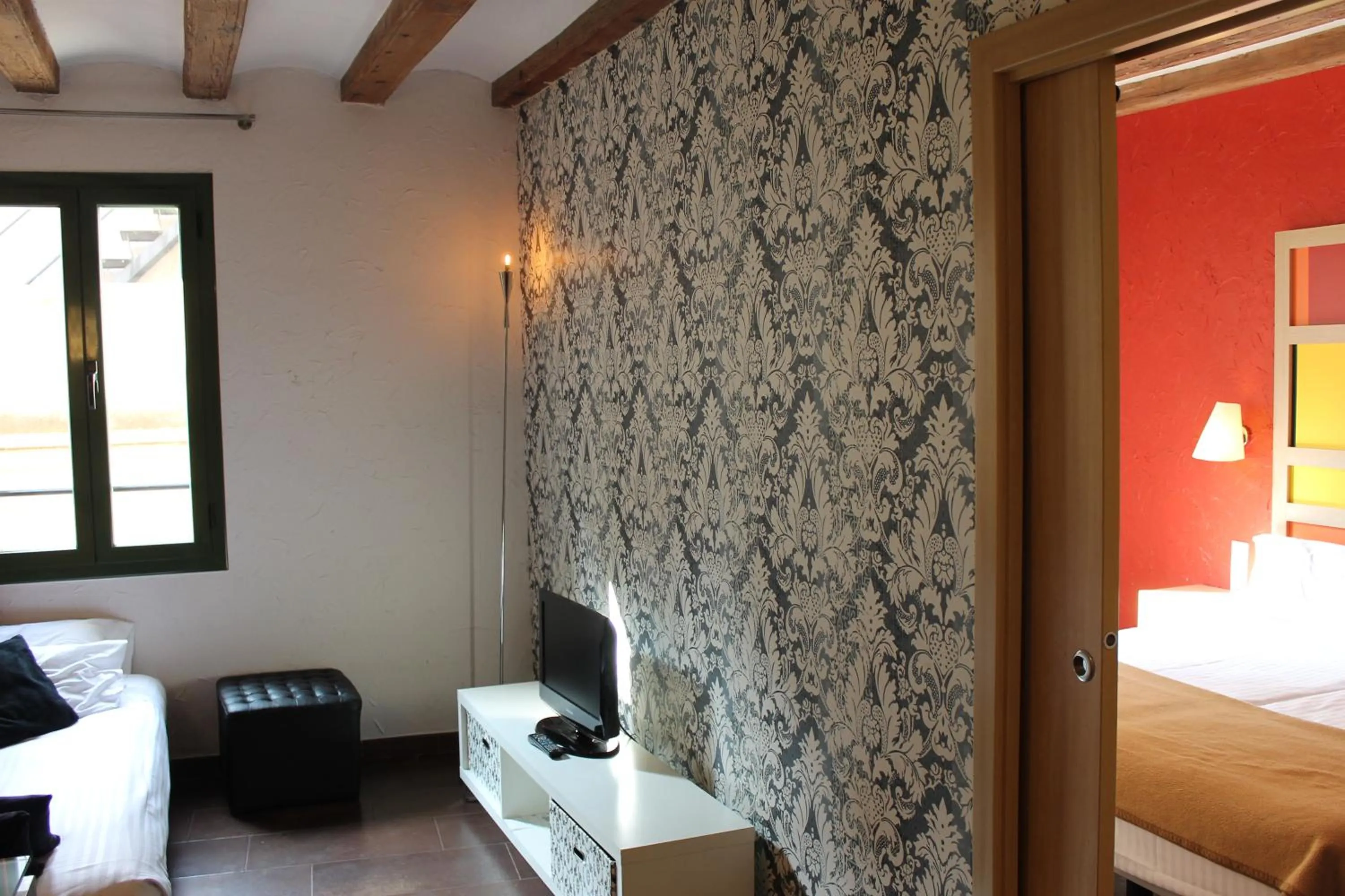 Living room, Bed in Apartaments Ciutat Vella