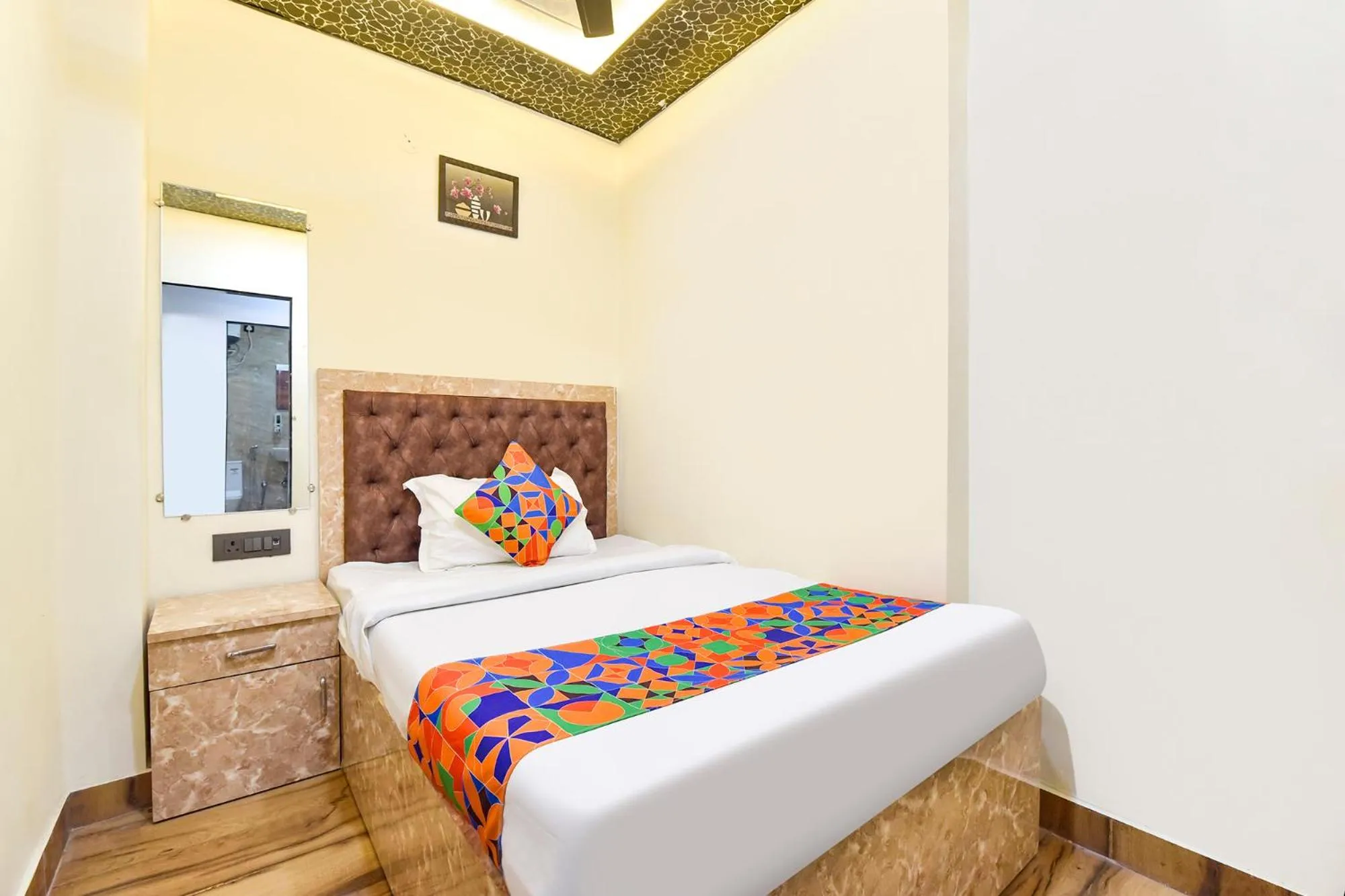 Bed in FabHotel Govindam Royal Stay