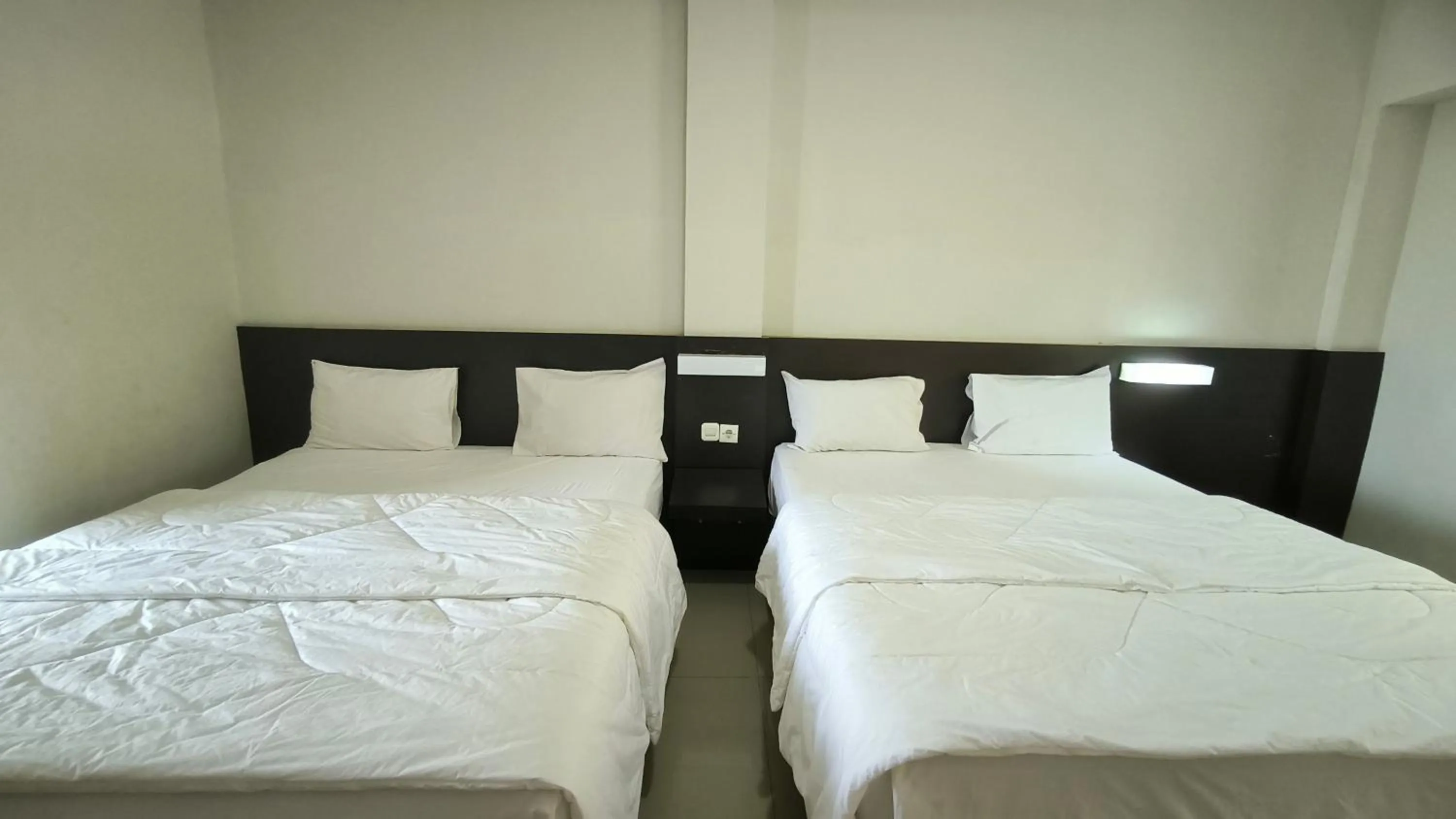 Bed in New Bandengan Beach Hotel