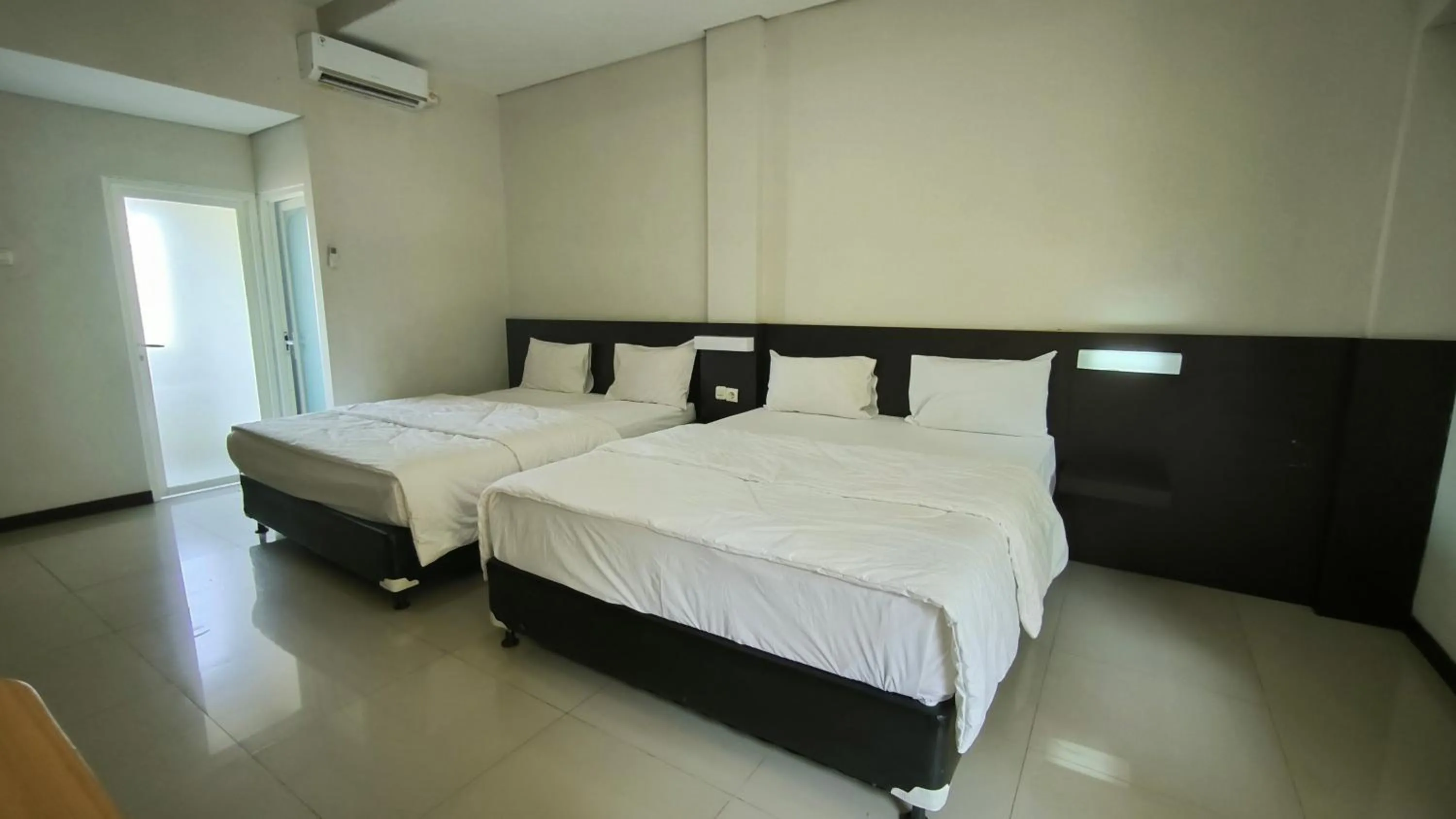 Bed in New Bandengan Beach Hotel