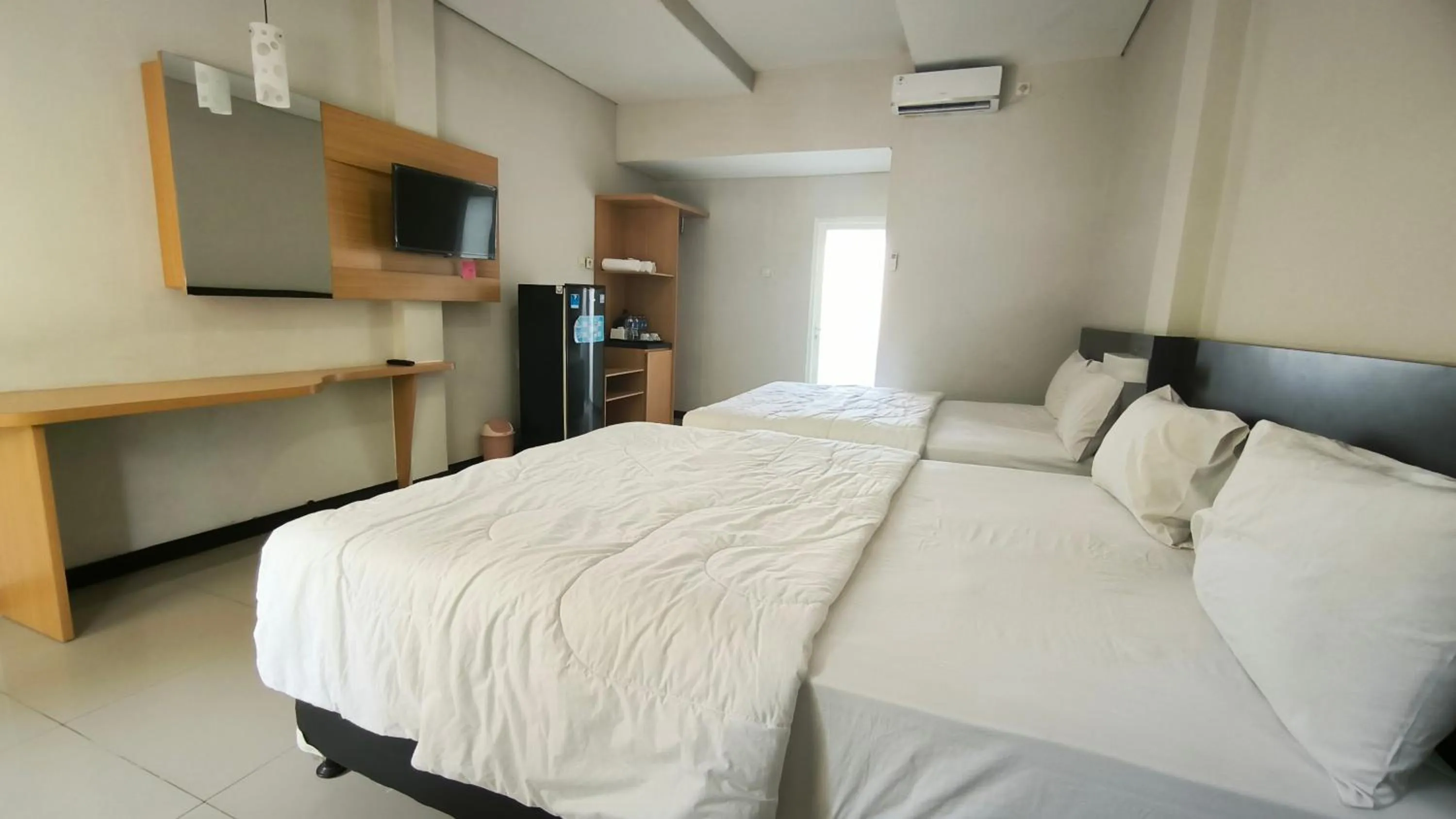 Bed in New Bandengan Beach Hotel