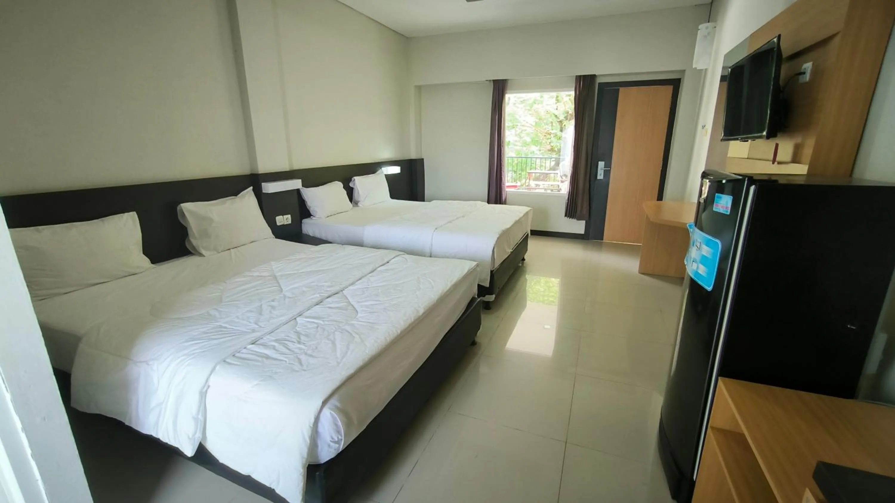 Bed in New Bandengan Beach Hotel