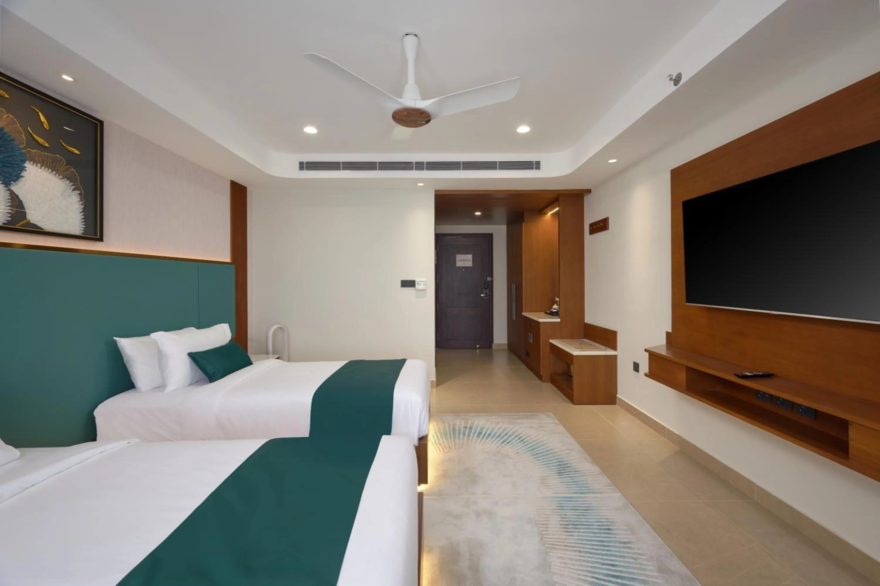 Bed in Kowju Airport Hotel Calicut