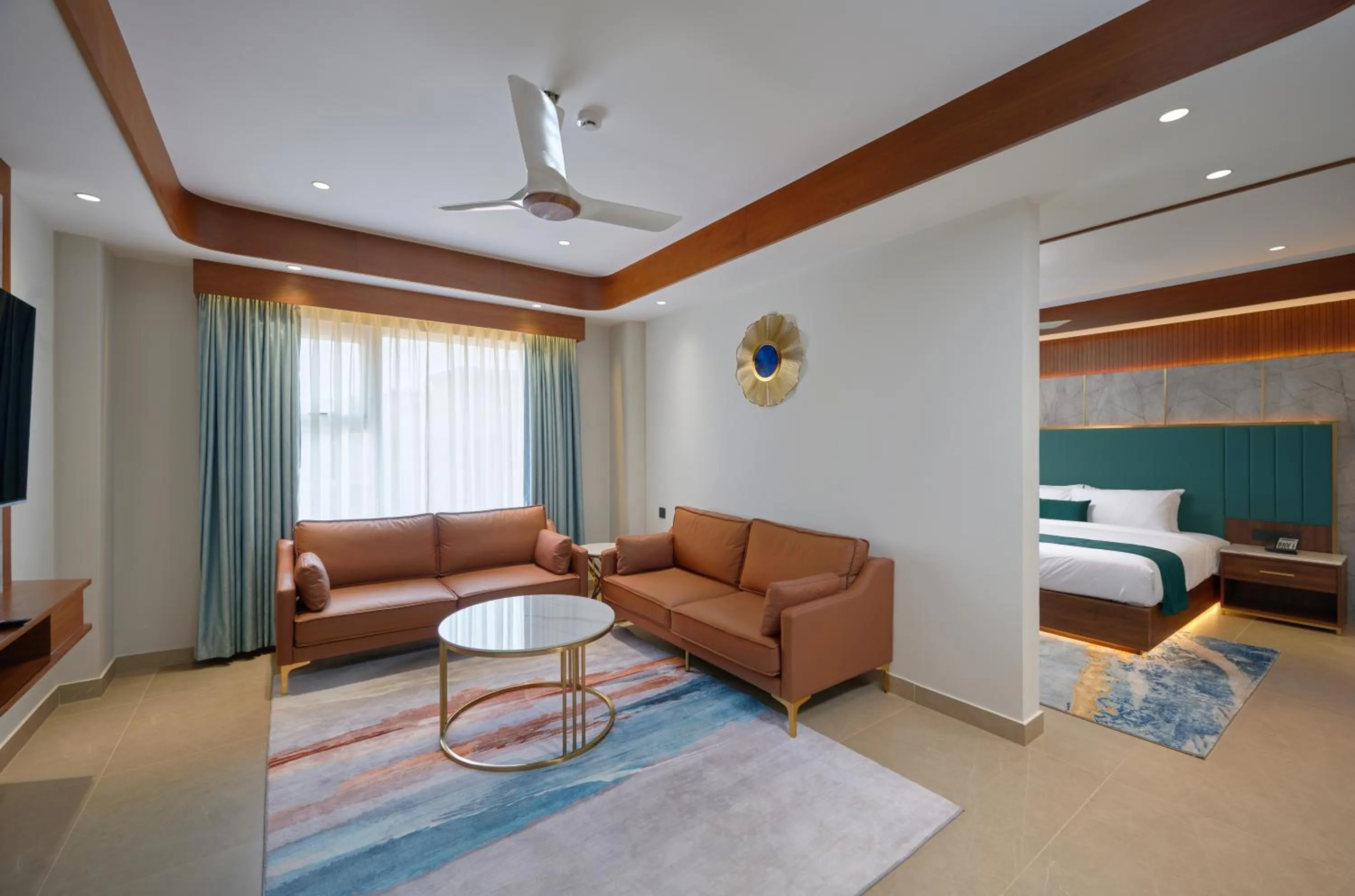 Living room, Bed in Kowju Airport Hotel Calicut