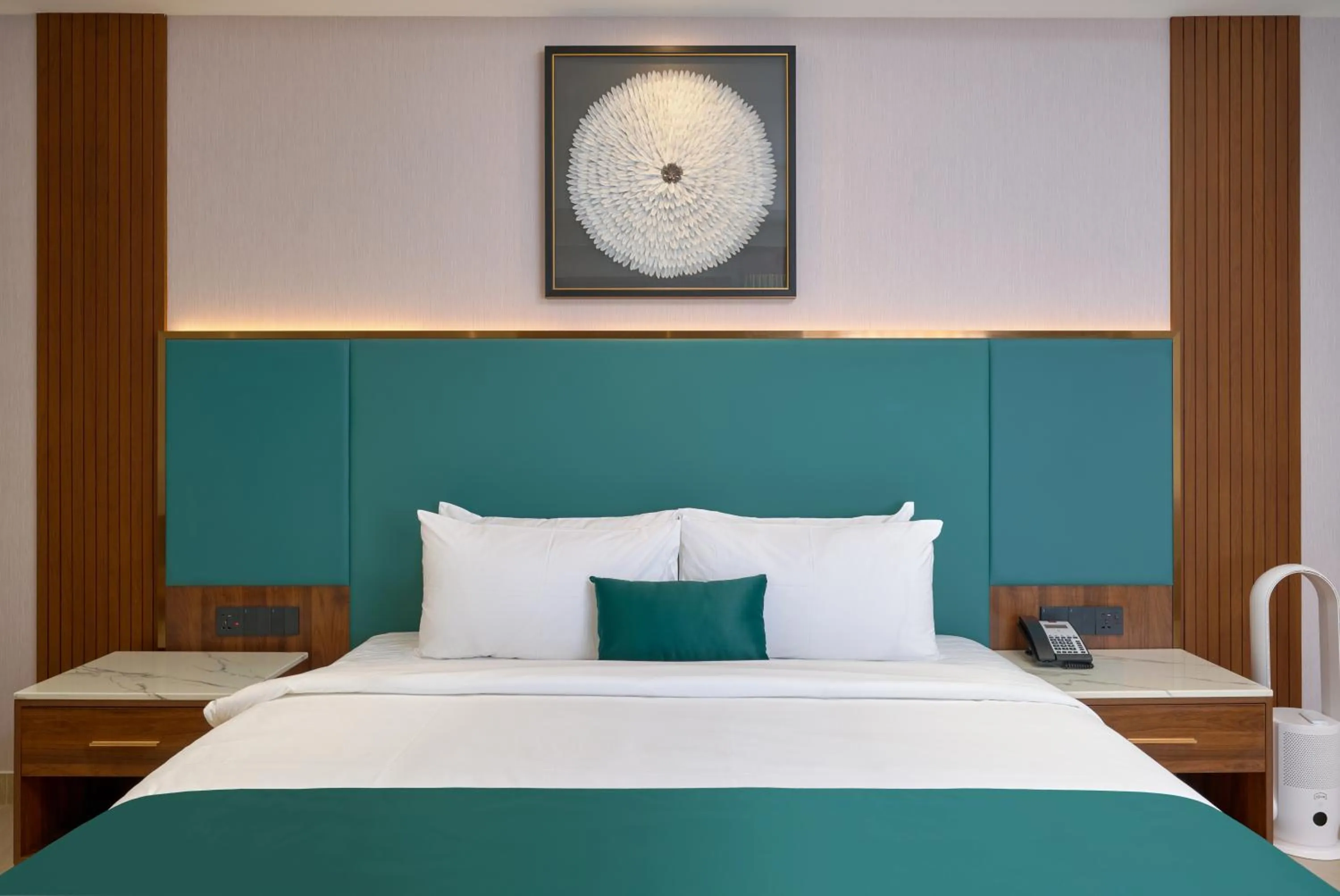 Bed in Kowju Airport Hotel Calicut