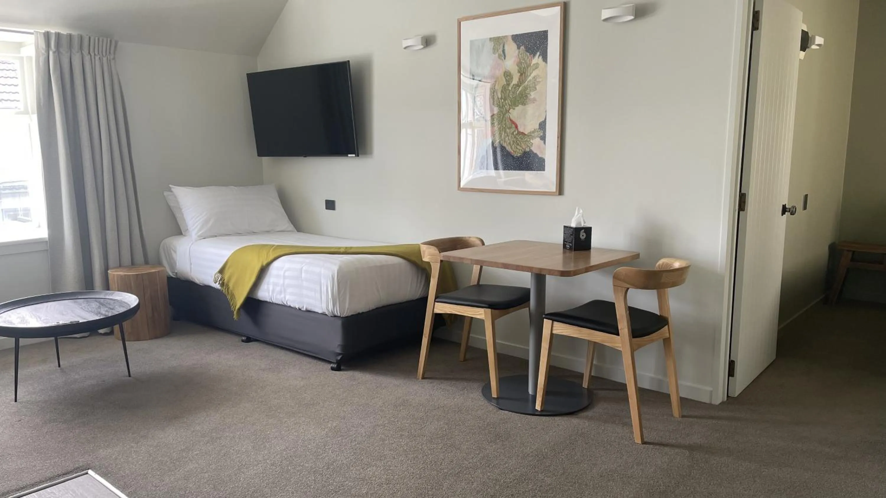 Bed in The Elmwood Motel