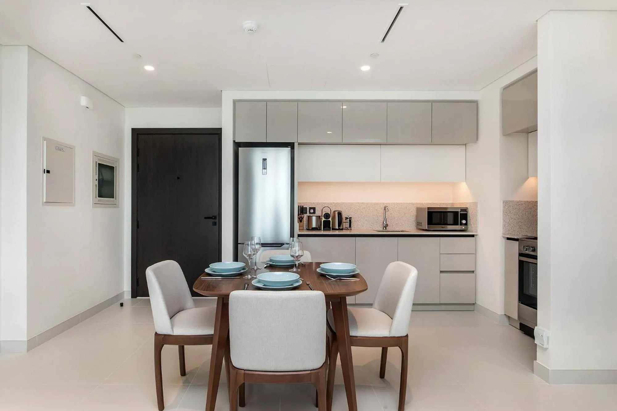 Kitchen or kitchenette in Chic Apartments in Marina Vista Emaar Beachfront