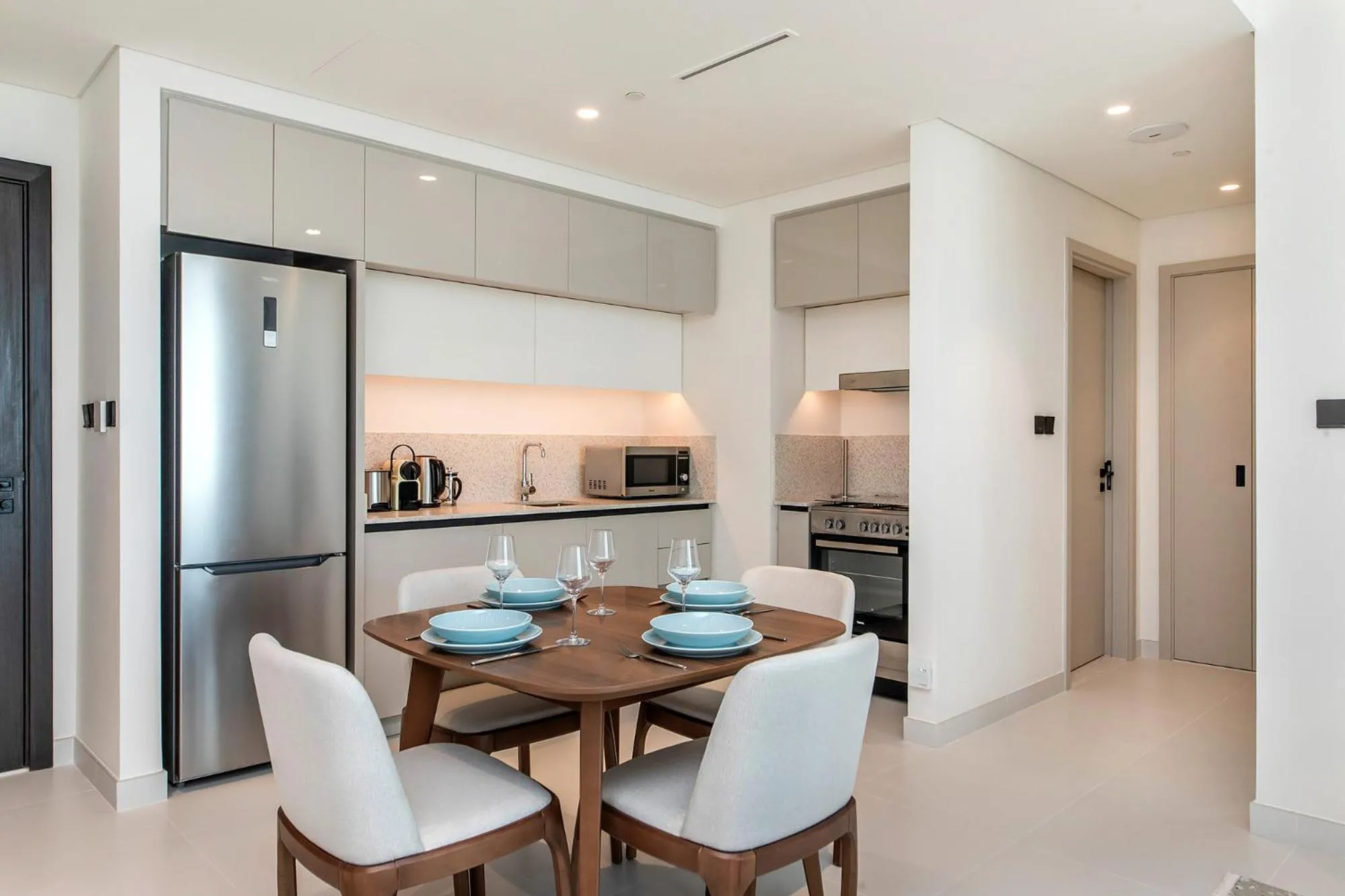 Kitchen or kitchenette in Chic Apartments in Marina Vista Emaar Beachfront