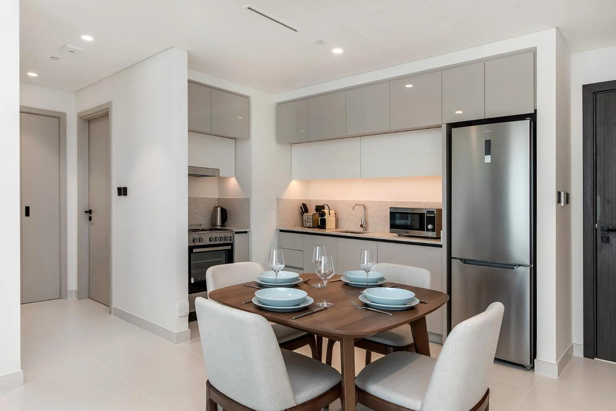 Kitchen or kitchenette in Chic Apartments in Marina Vista Emaar Beachfront