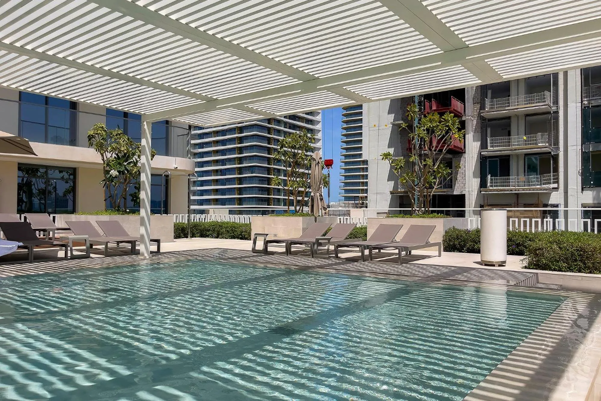 Swimming pool in Chic Apartments in Marina Vista Emaar Beachfront