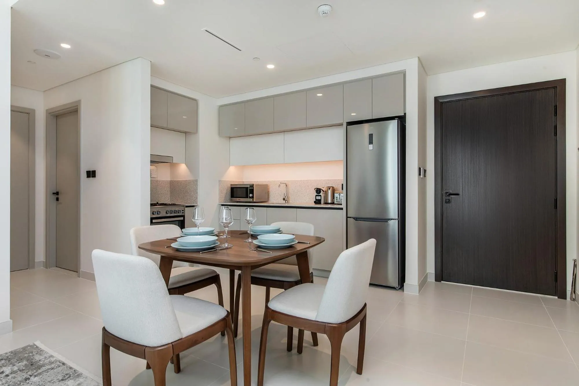 Kitchen or kitchenette in Chic Apartments in Marina Vista Emaar Beachfront