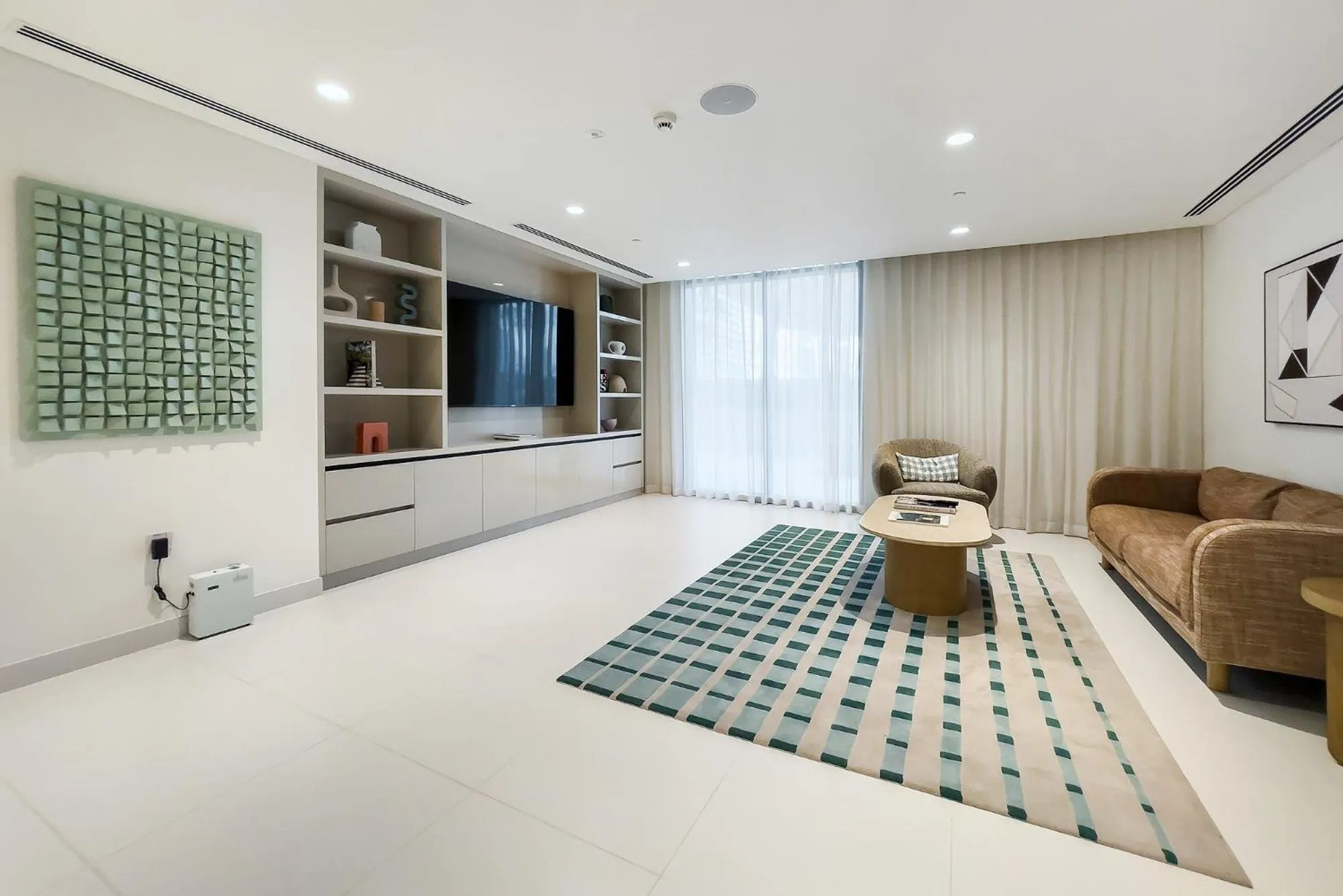 Communal lounge/ TV room in Chic Apartments in Marina Vista Emaar Beachfront