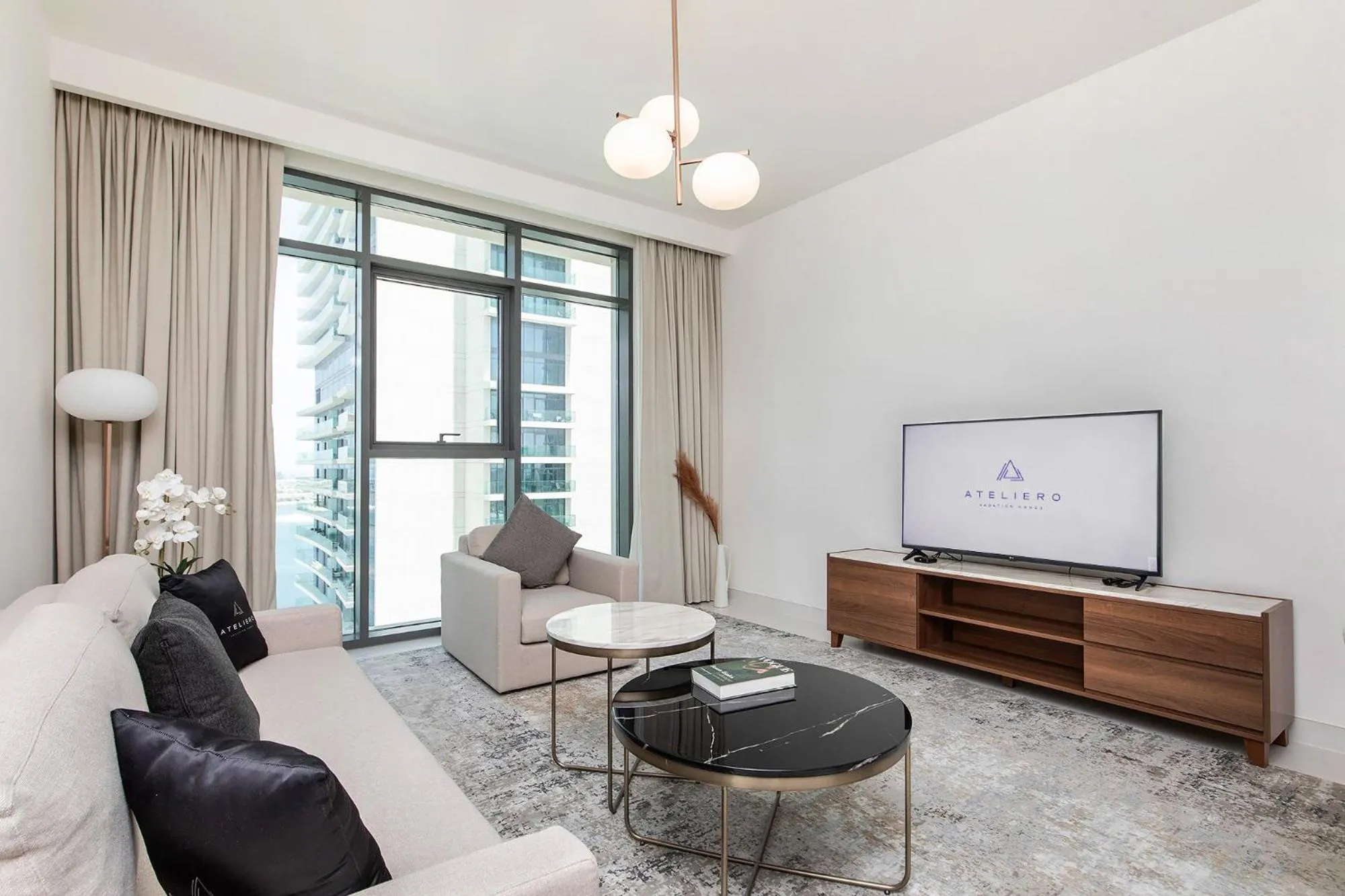 TV and multimedia in Chic Apartments in Marina Vista Emaar Beachfront