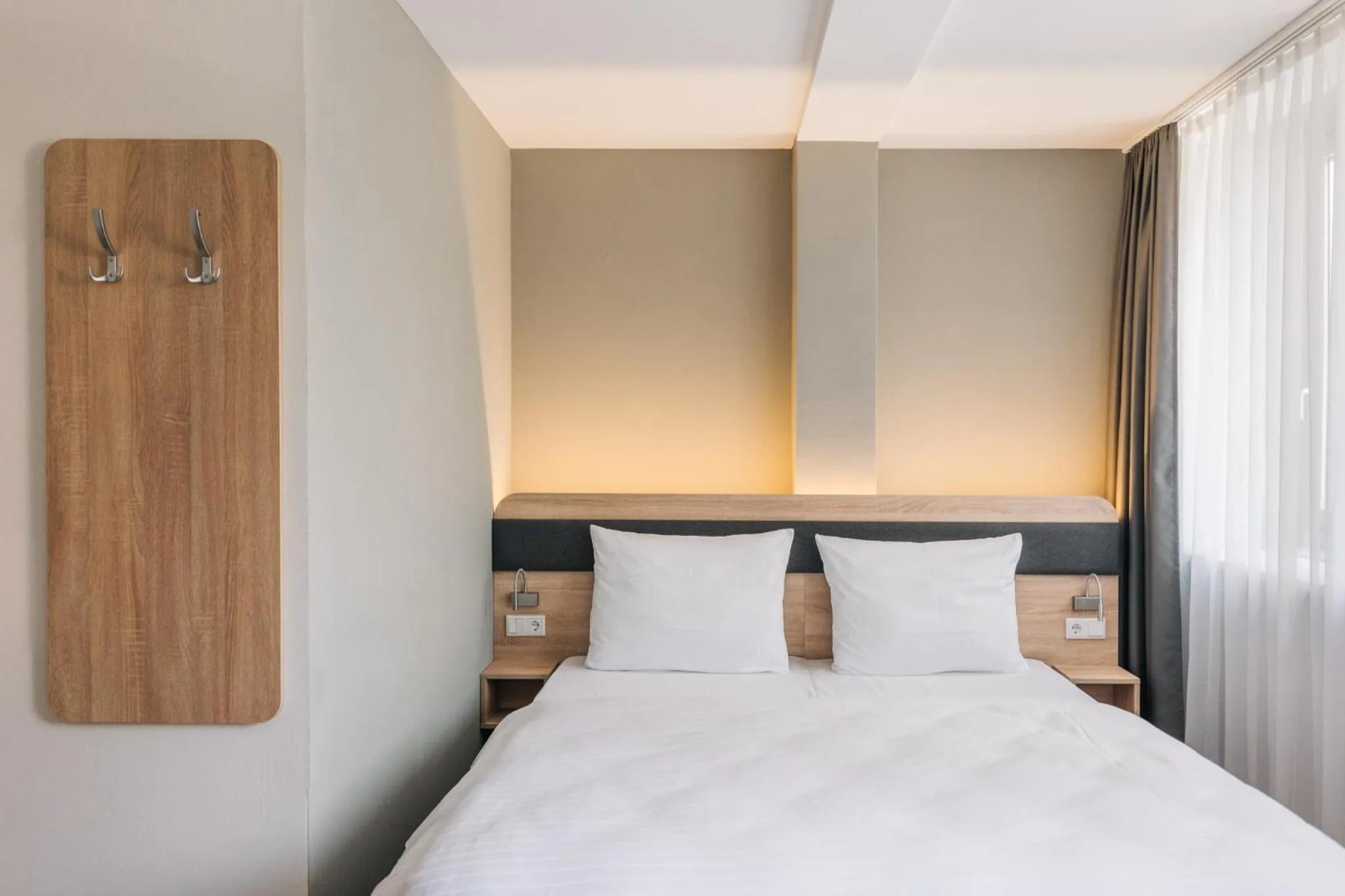 Bed in Homaris Corner Hotel