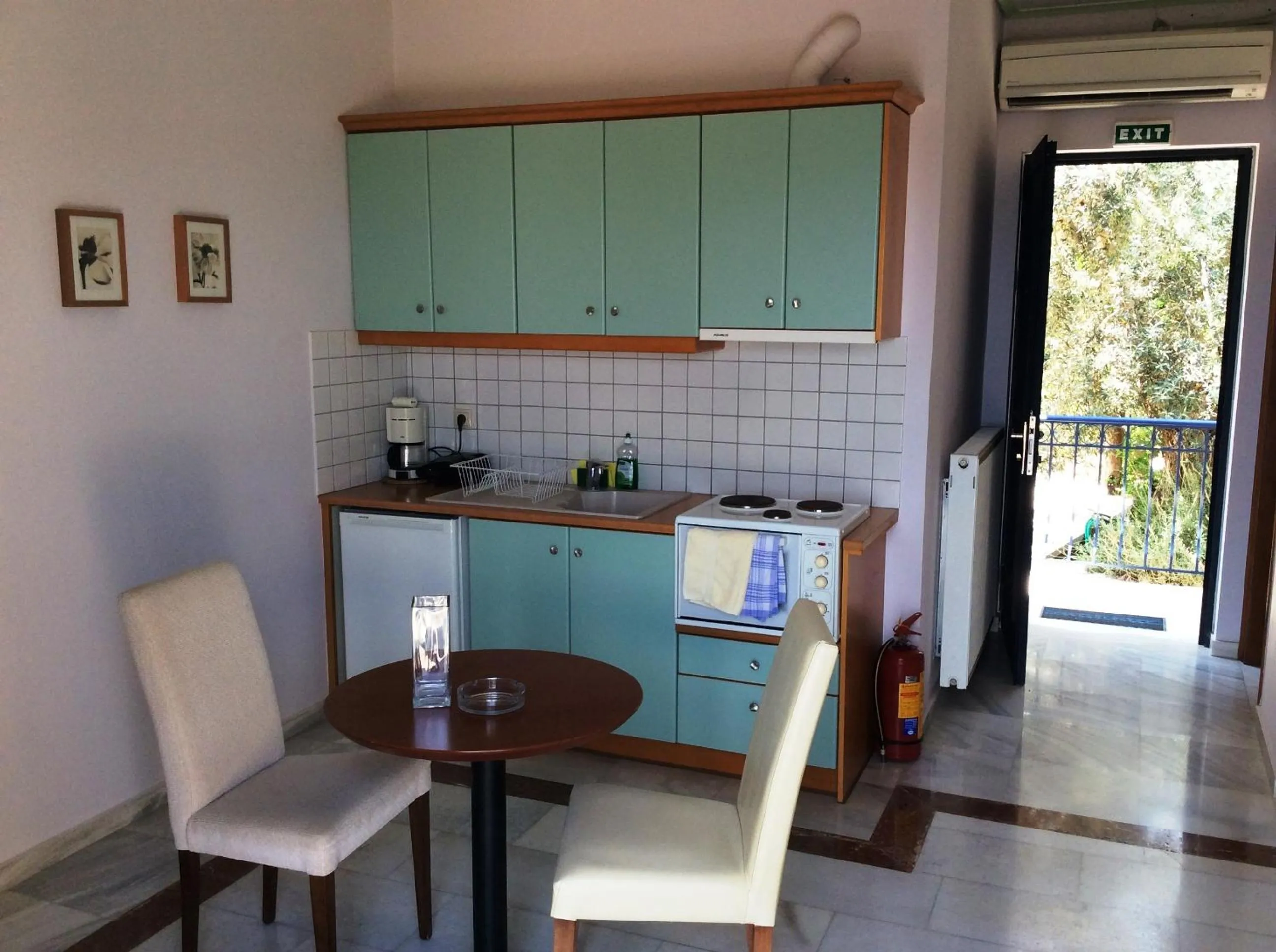 Kitchen or kitchenette in Angelica Villas Hotel Apartments